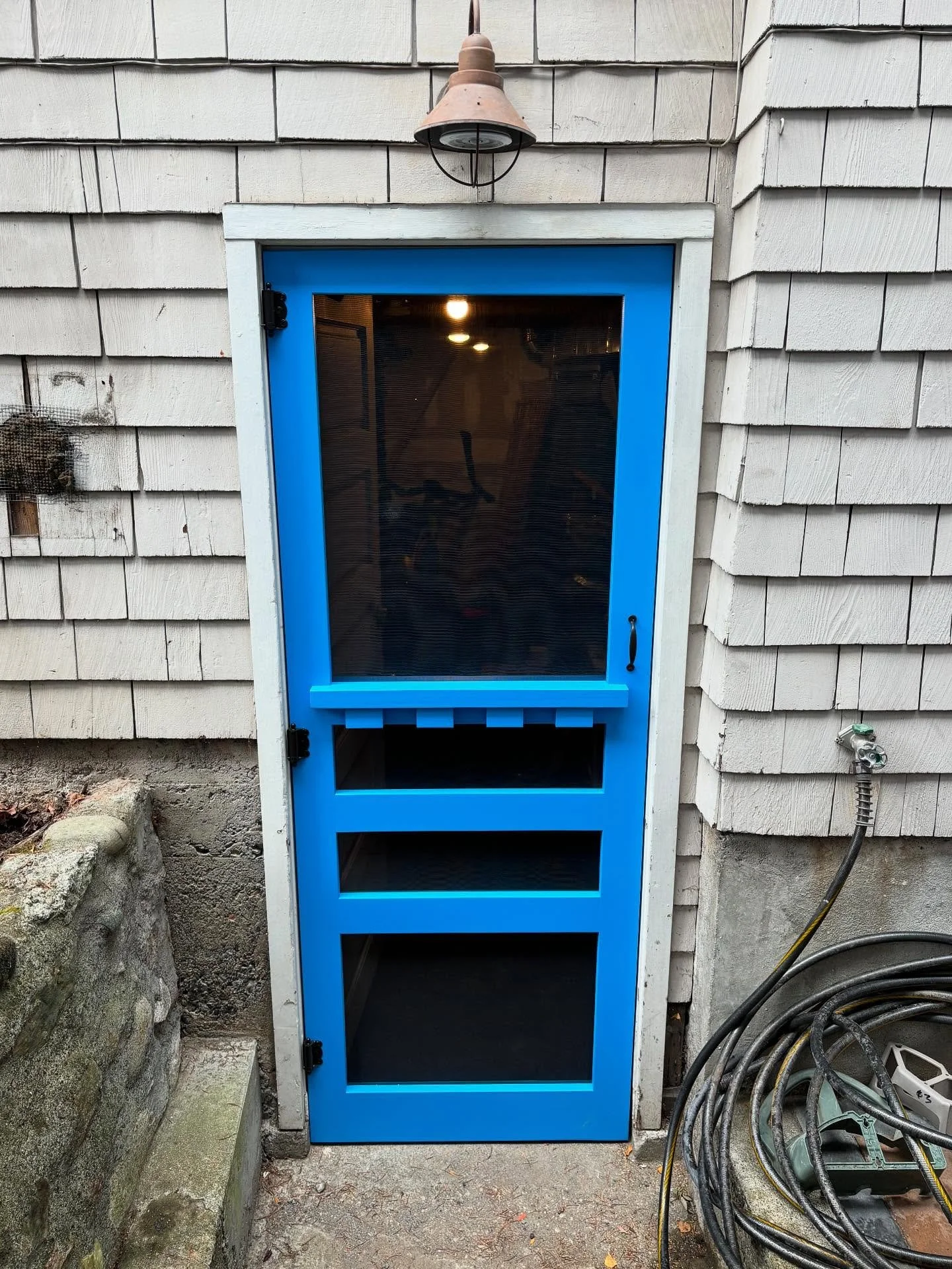 A pop of bright blue for this Capitol Hill home. The homeowners are building out their side patio and wanted to start with a custom screen door to set the tone. They asked for a dentil shelf on the outside and a full shelf on the inside for a little