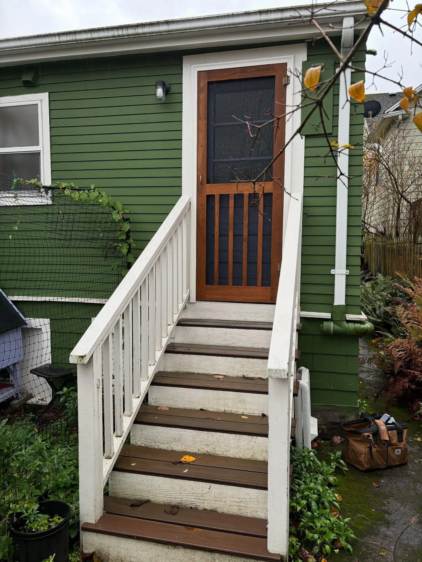 These twin screen doors were designed to echo the railing that leads up to them, creating a seamless connection between the entry and the porch. The lines in the railing were mirrored in the layout of the doors for a subtle detail that ties everythin