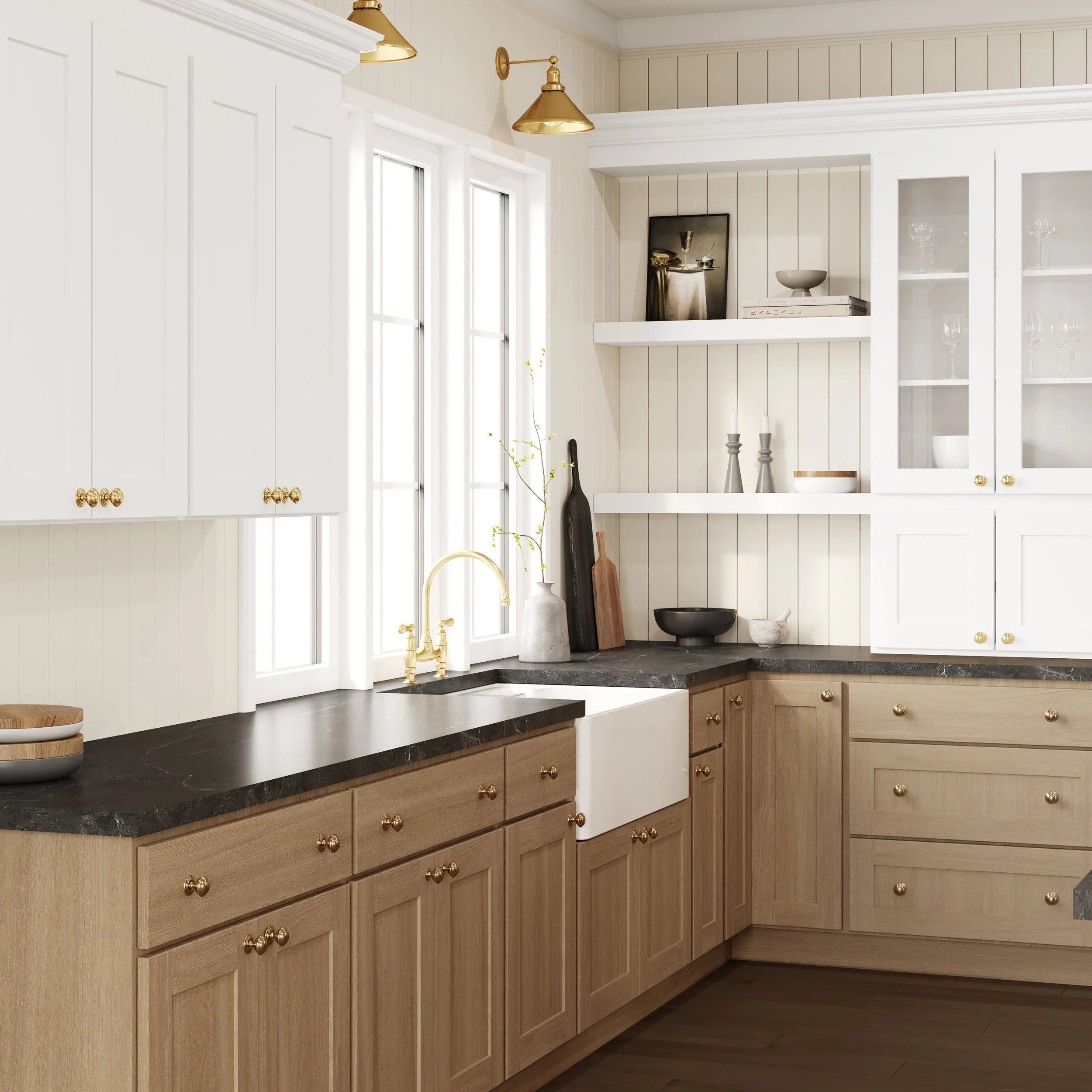 A kitchen with white upper cabinets and light wood lower cabinets, black marble countertops, and gold hardware. There are two windows with white frames, and decorative items including a black vase, a small white bowl, and a book are placed on the shelves. Gold pendant lights hang from the ceiling.