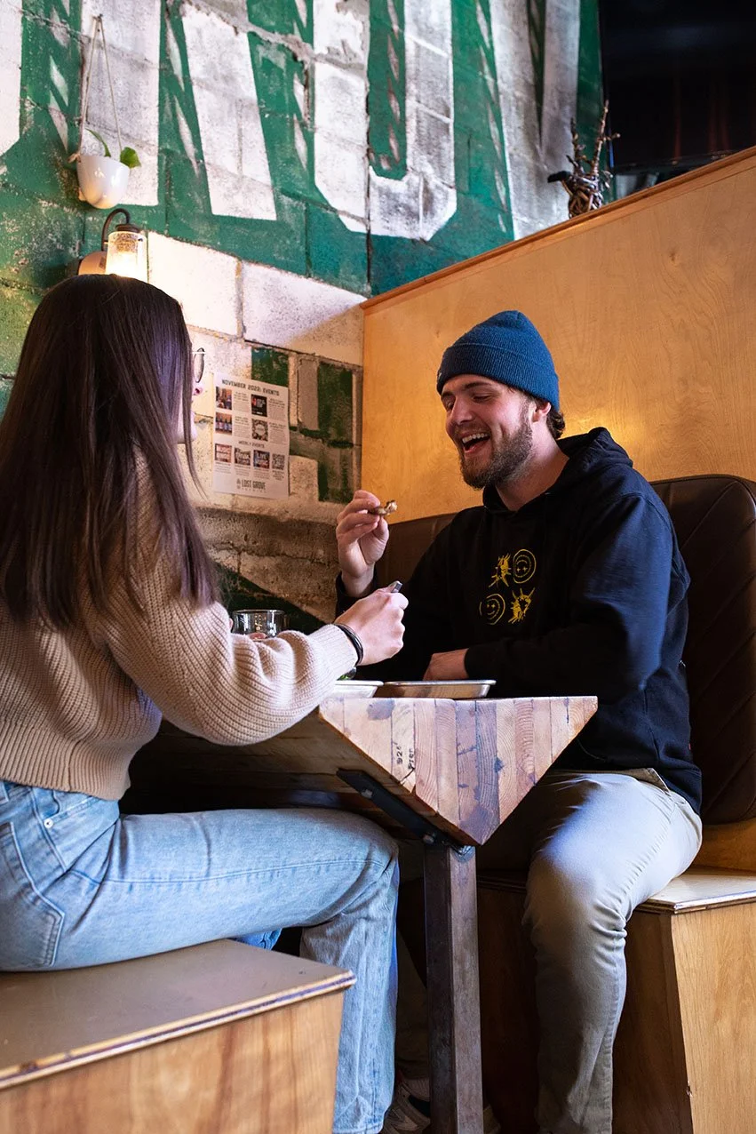 lost grove brewing boise idaho couple lifestyle photography pizza beer salad smiling man.jpg