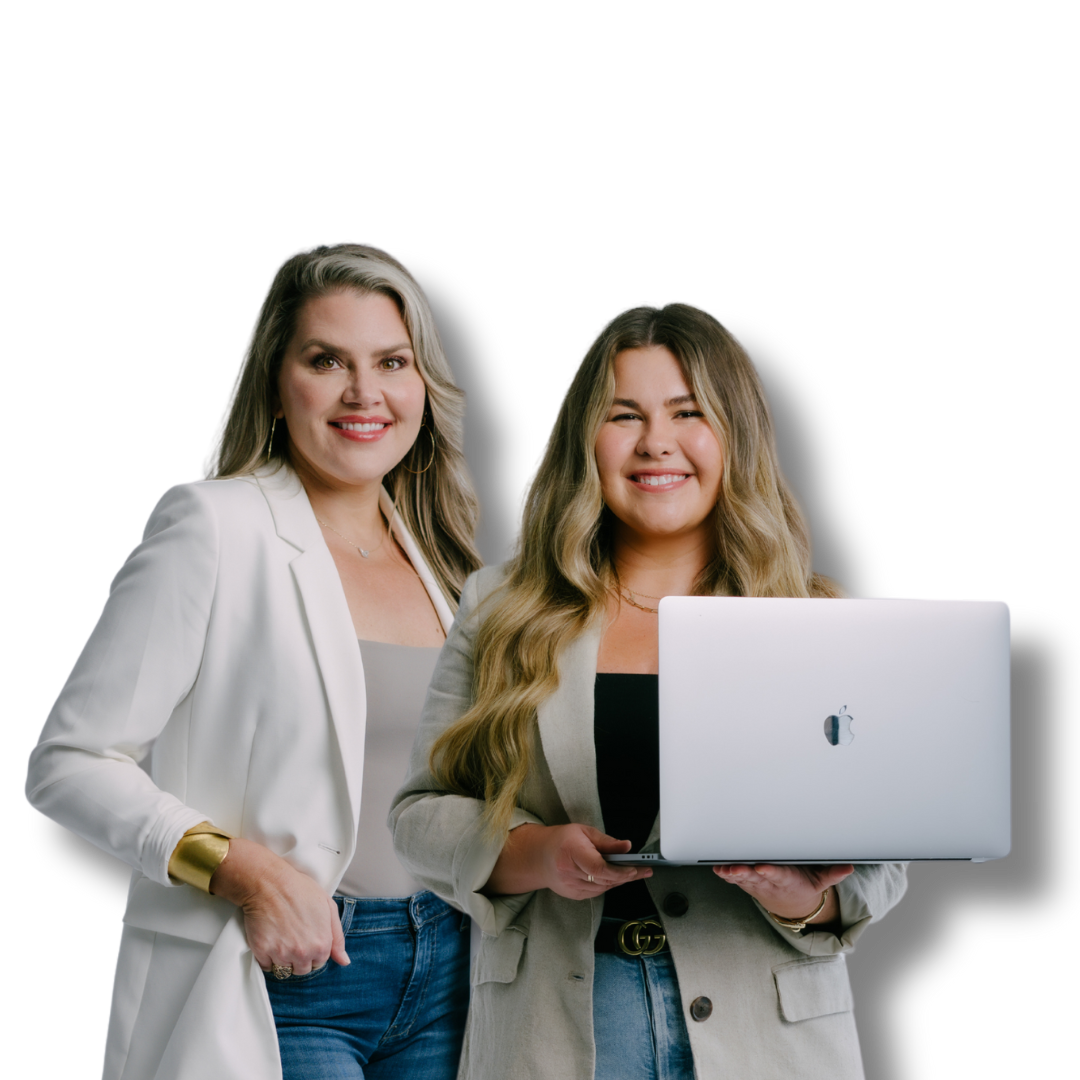 Two women wearing neutral colored blazers