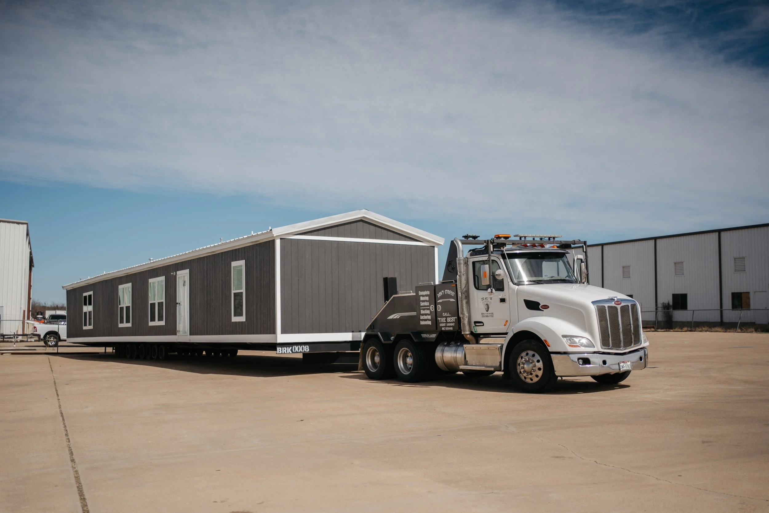 Manufactured home delivery at Homestead Corpus Christi captured by 2ten Marketing during early community development