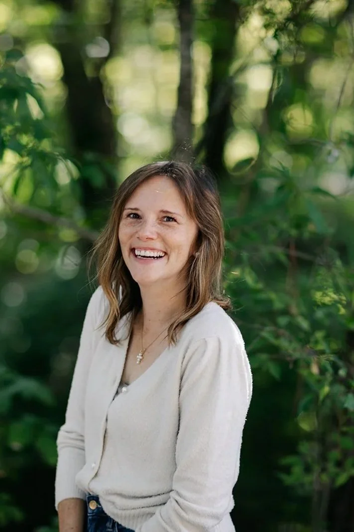 Amy Eaton Author, Christian Speaker and Leadership Consultant, laughing with natural trees background.