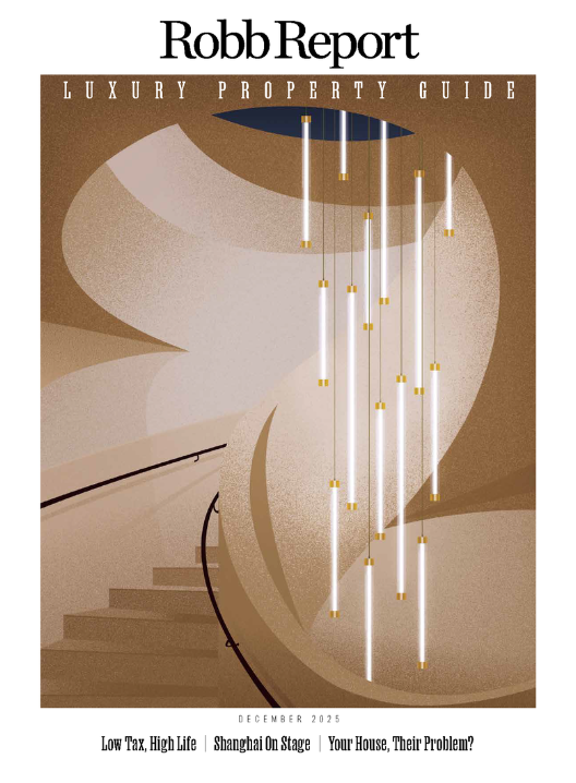 Cover of Robb Report luxury property guide for December 2025 featuring a modern staircase with hanging pendant lights.