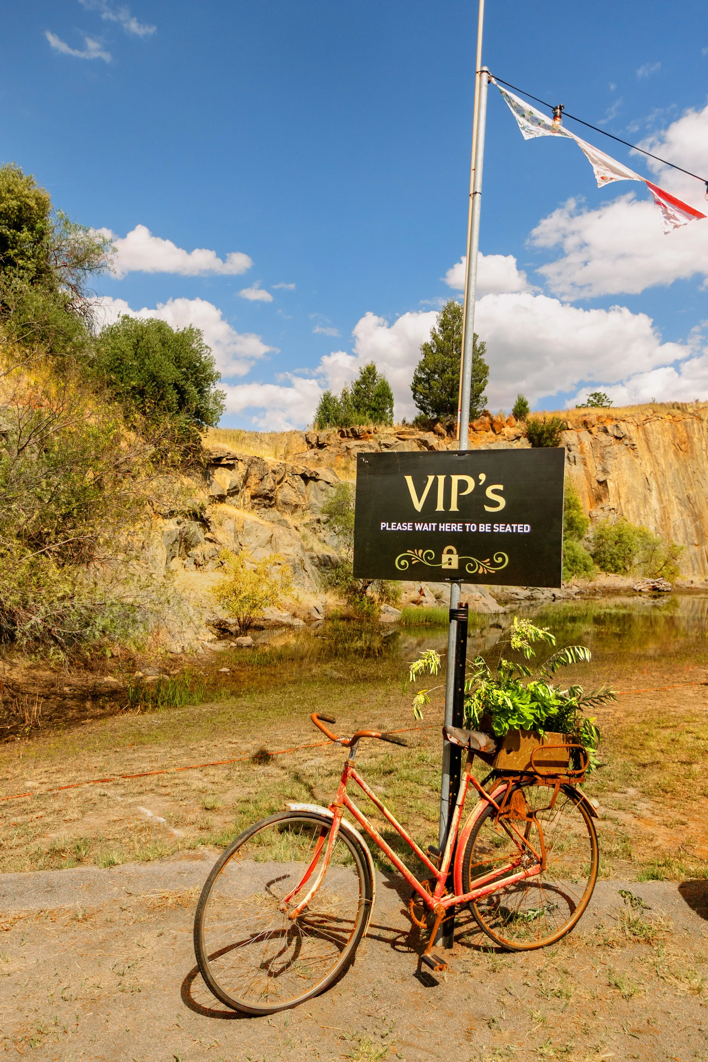 A retro bike holding a sign for VIP's.