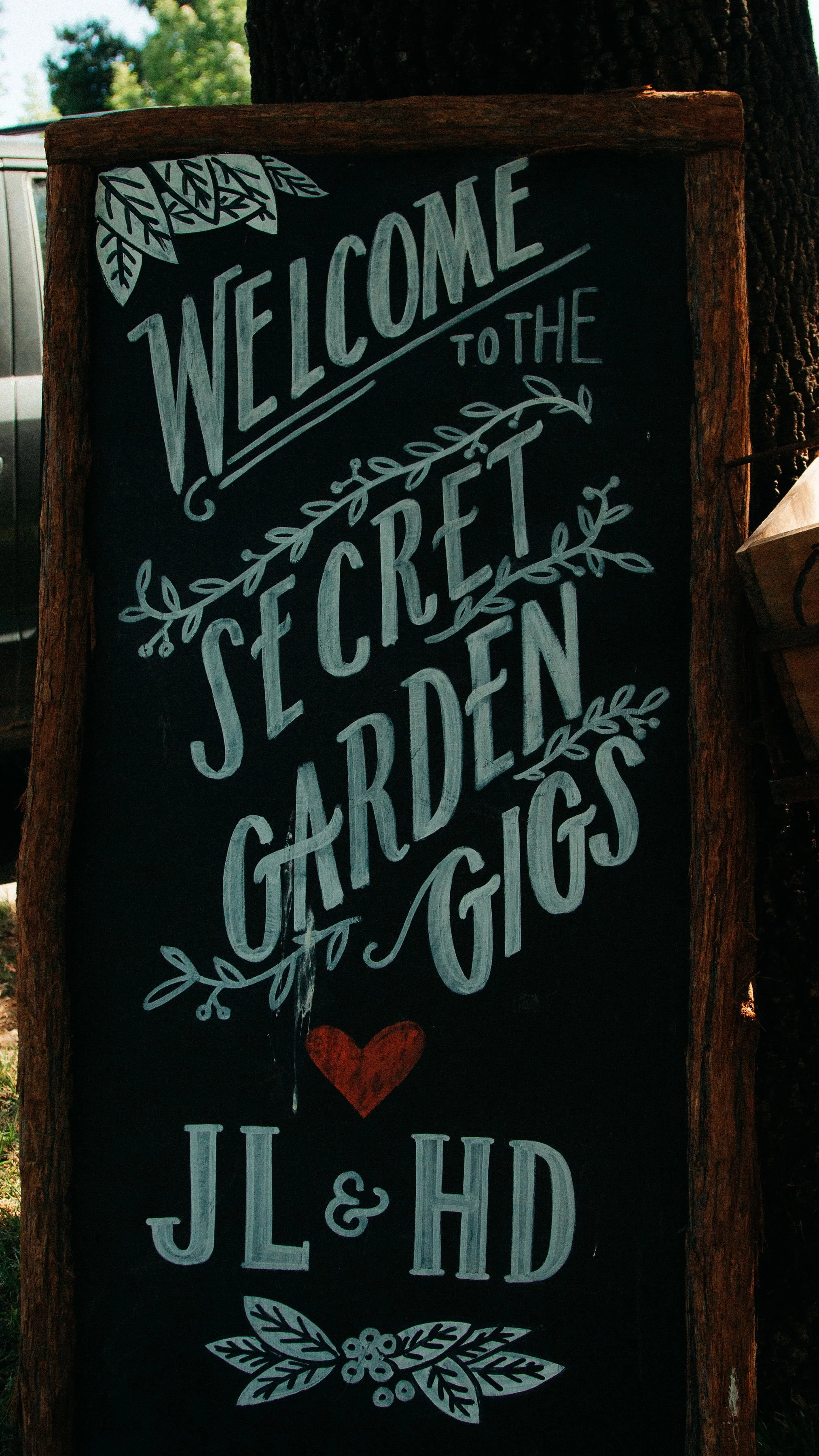 Welcome to the Secret Garden Gig: an enchanting sign beckoning you to a hidden musical paradise.