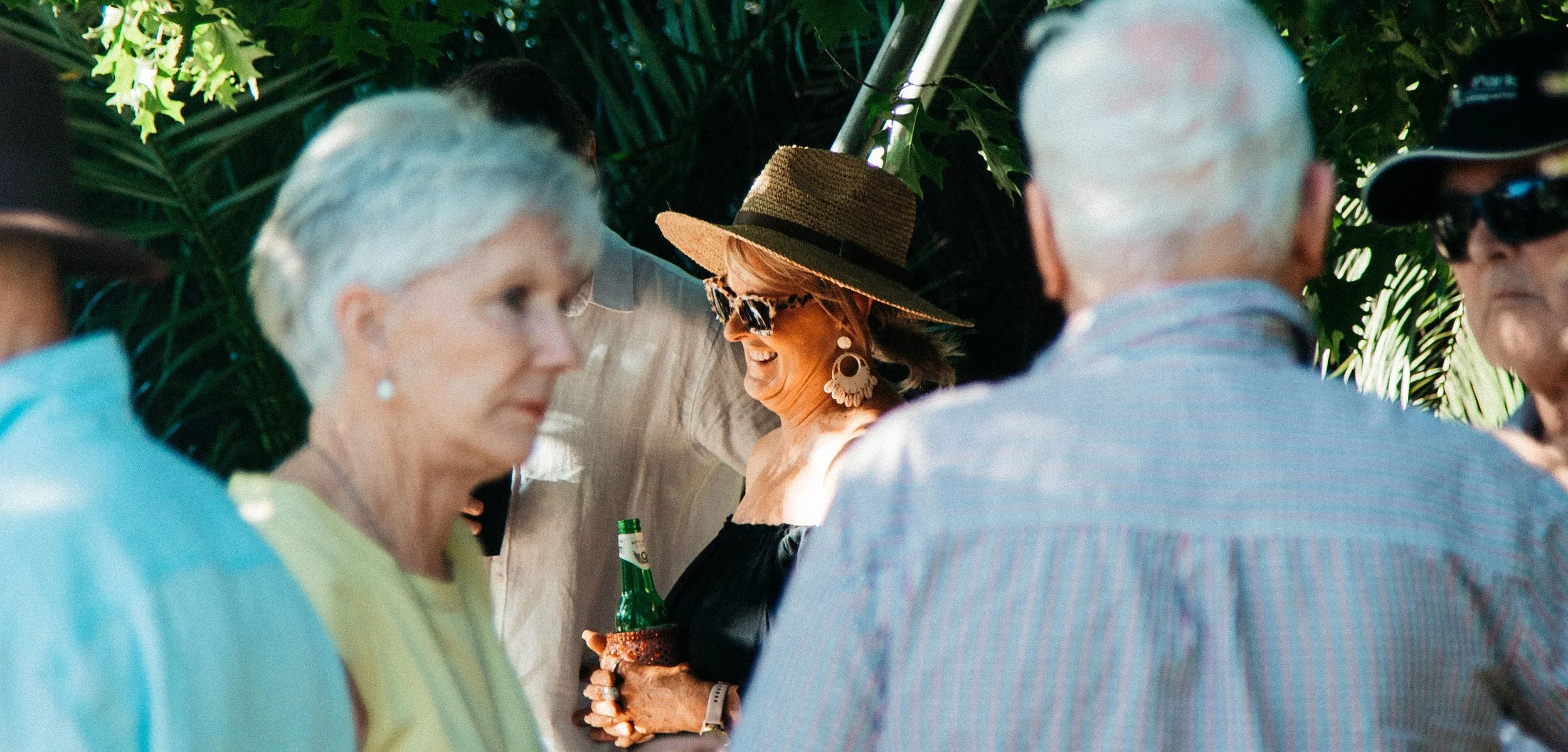 An enchanting garden venue with vibrant blooms and cozy seating, ready for an intimate live music event.