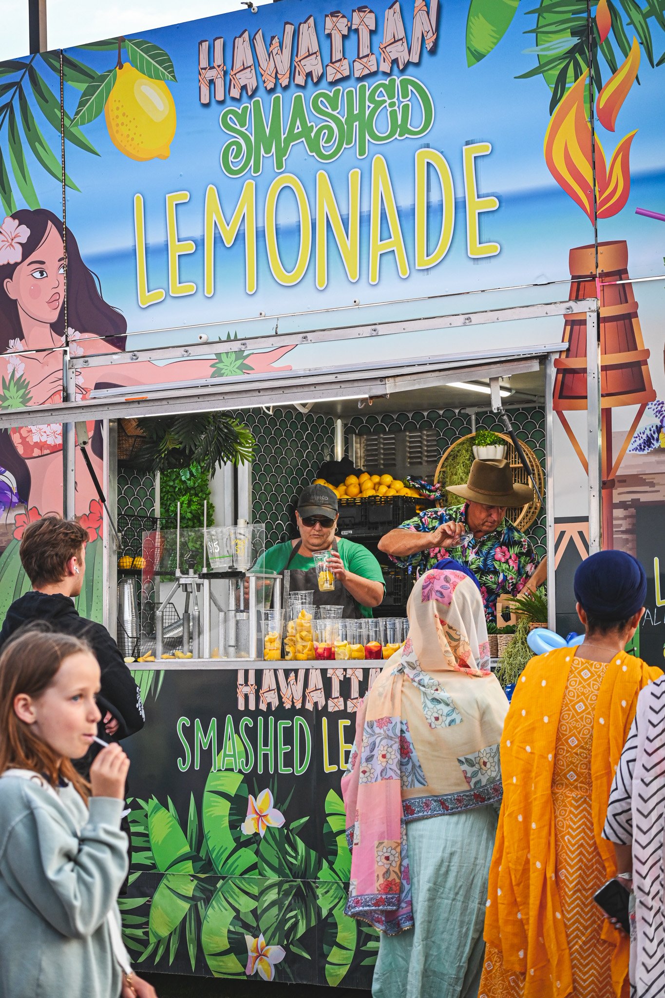 A diverse array of dishes from around the world showcased at a vibrant food festival.