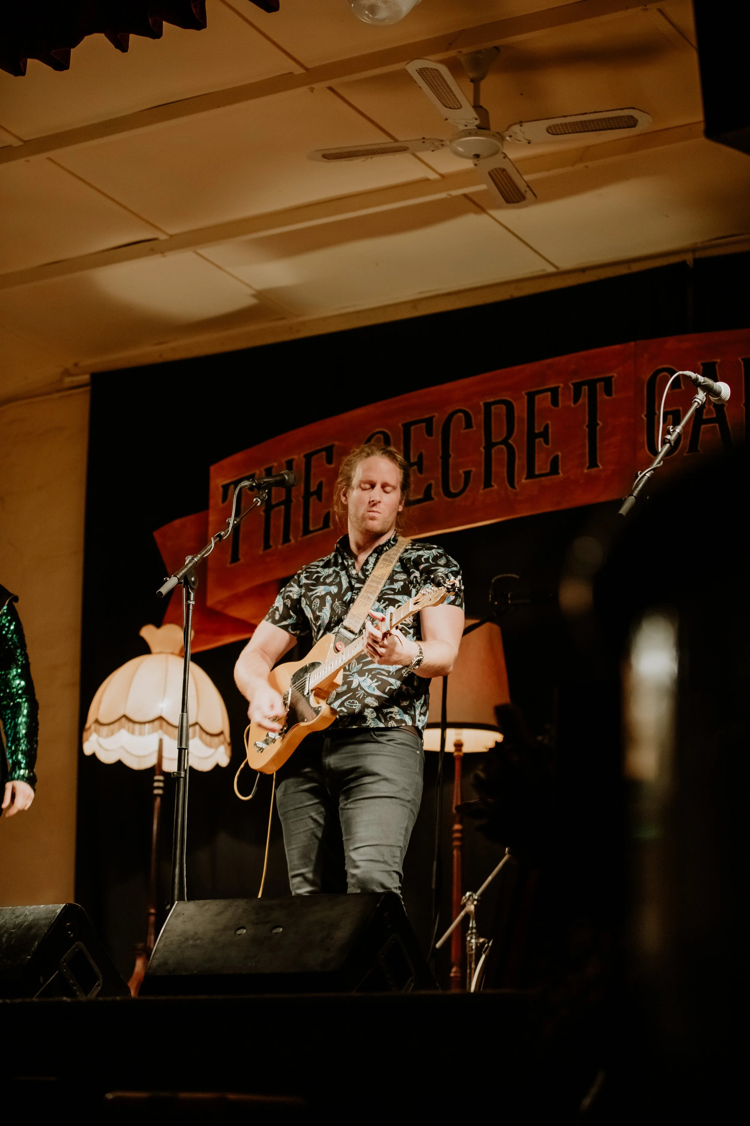 A man plays guitar at The Secret Garden Gigs.