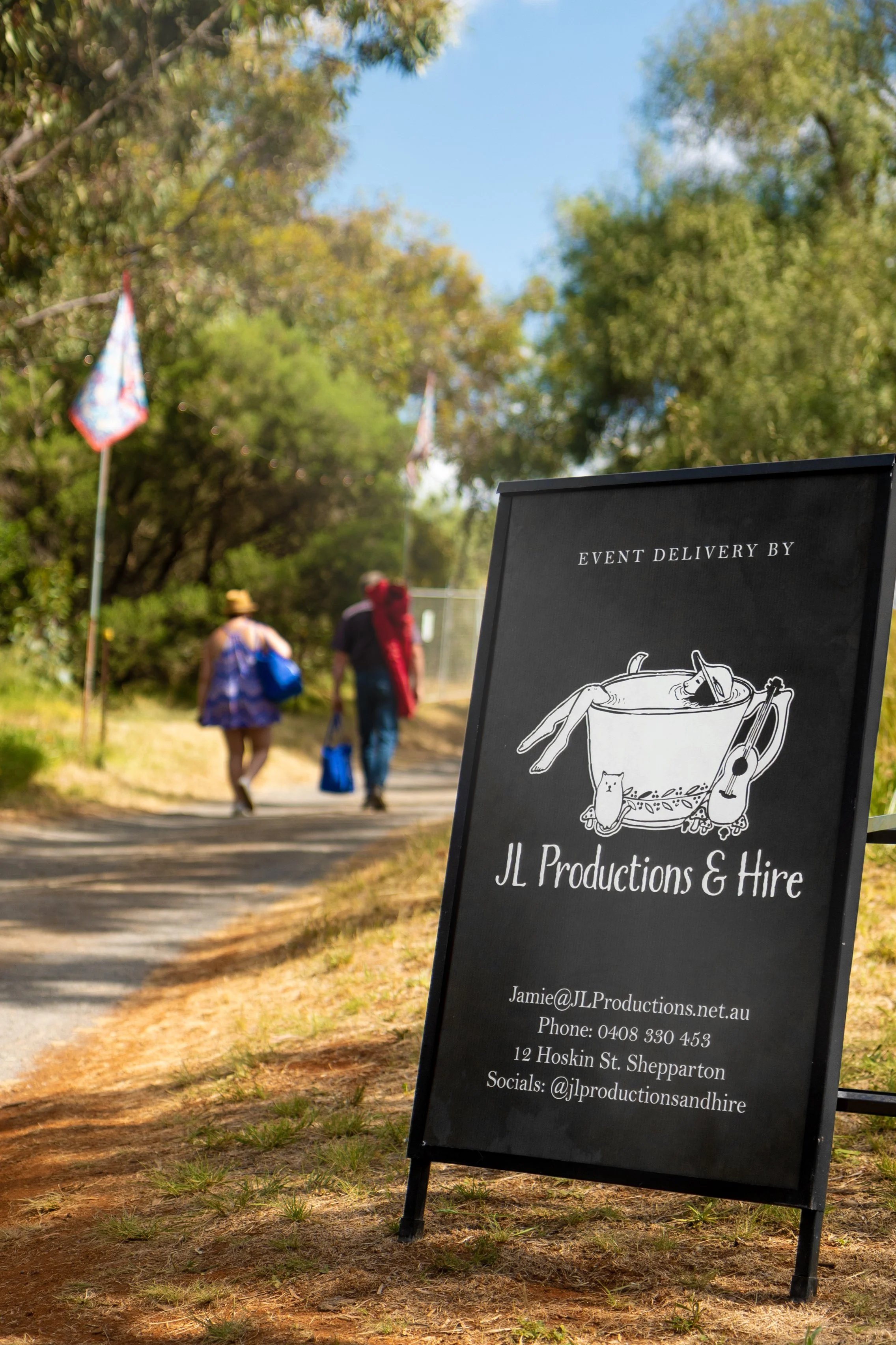 A sandwich sign for JL Productions & Hire.