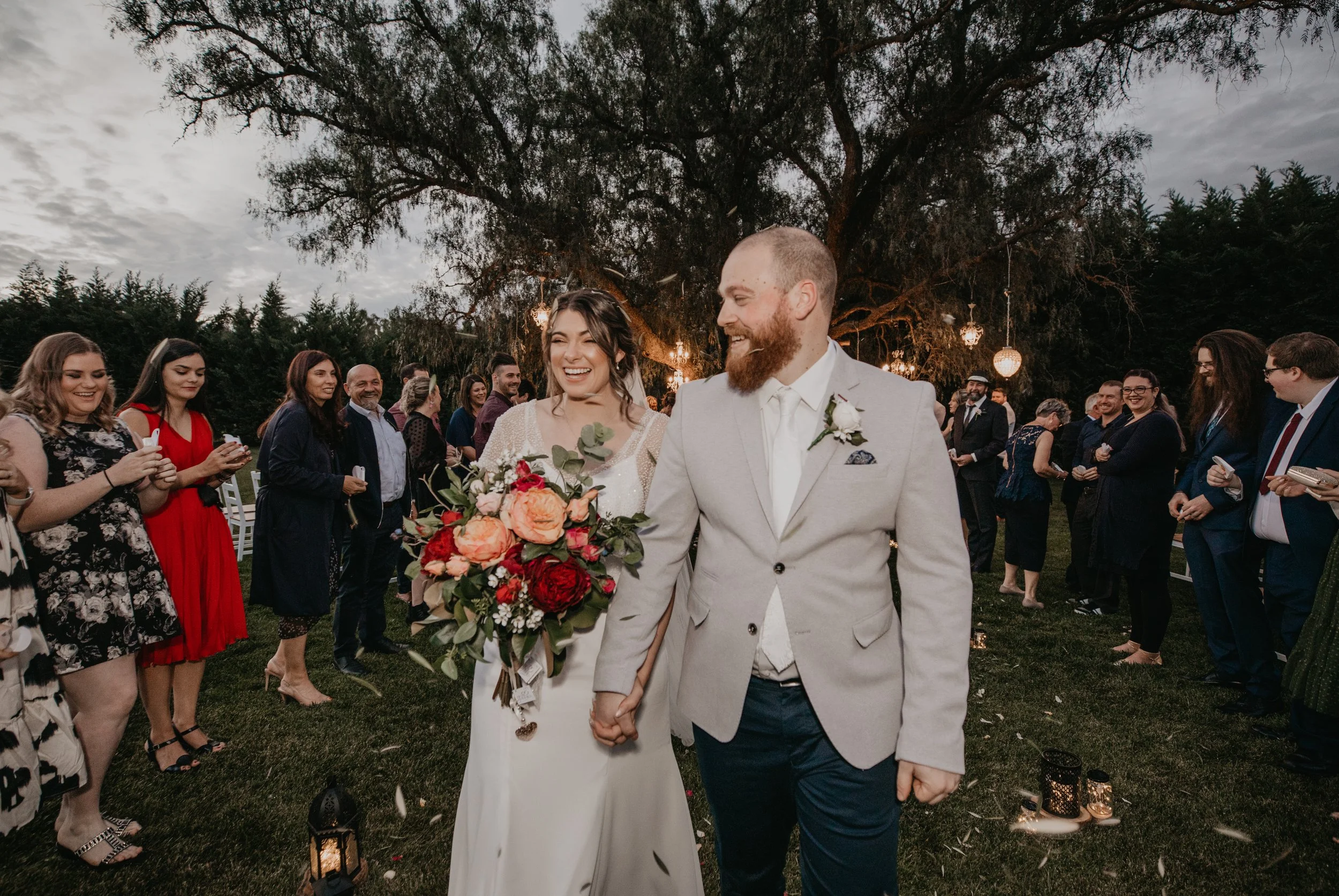 Bride and Groom walk happily down the aisle after exchanging vows.