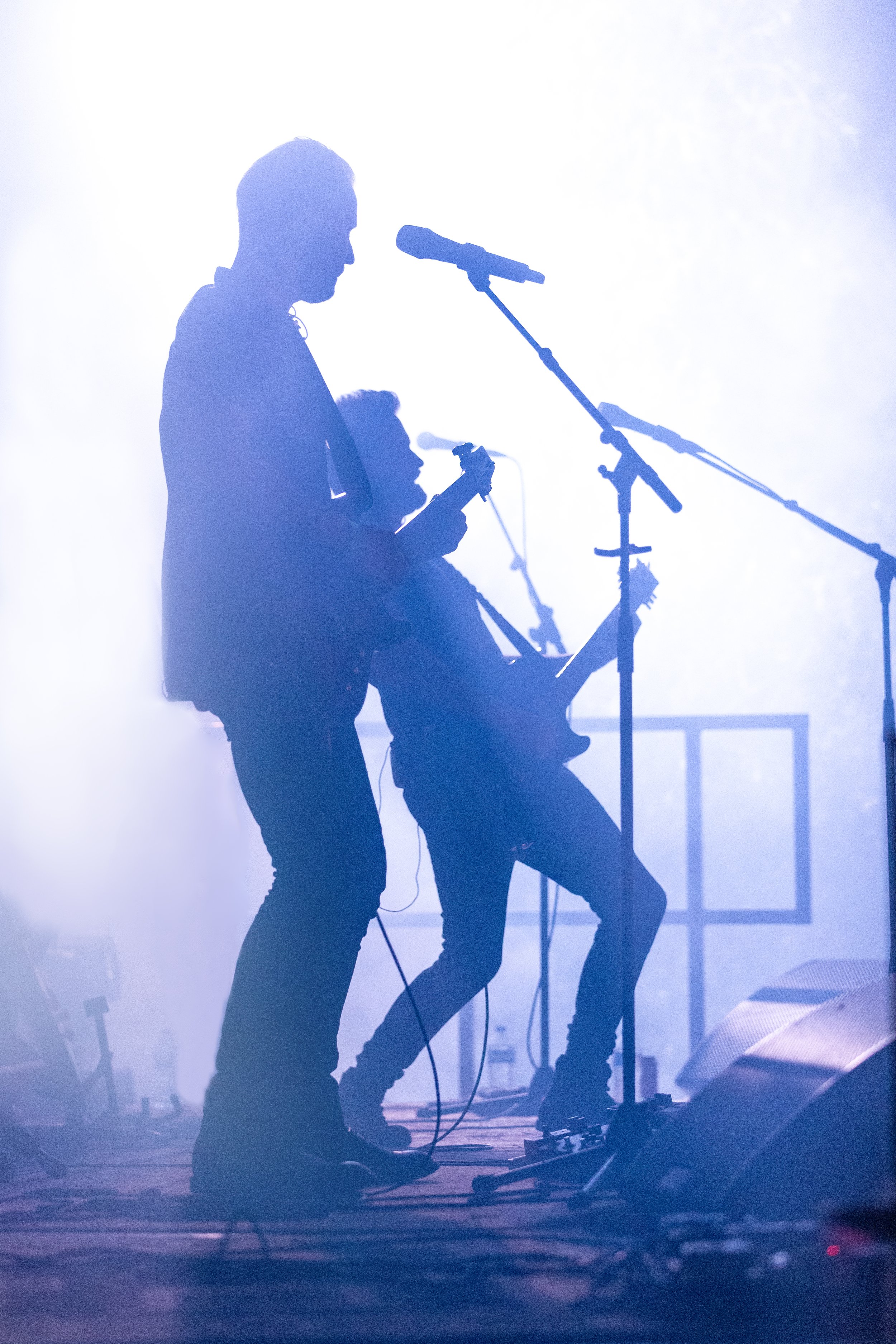 Silhouettes of two men giving an enthralling performance.