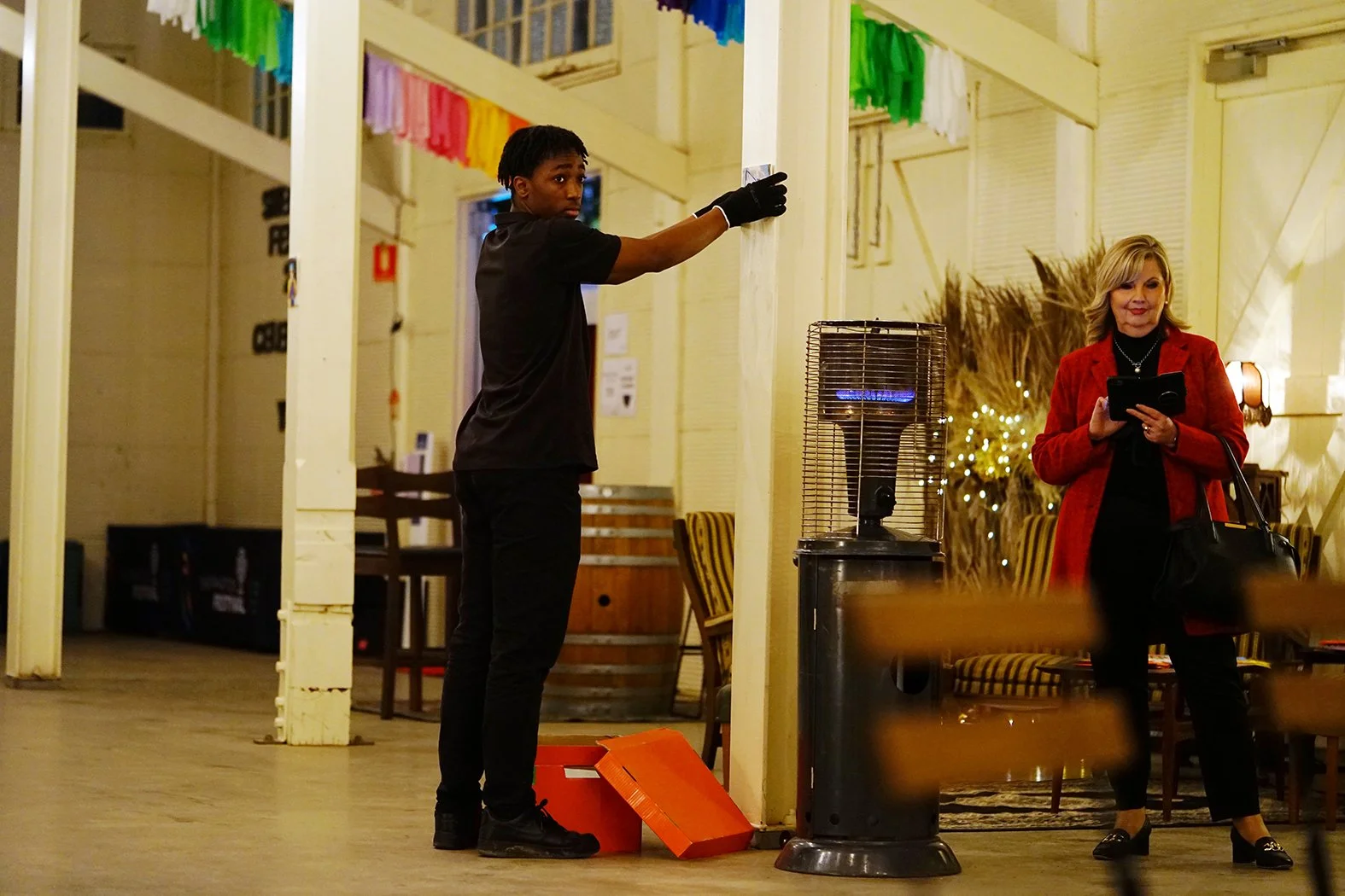 A man and woman helping set up the event.
