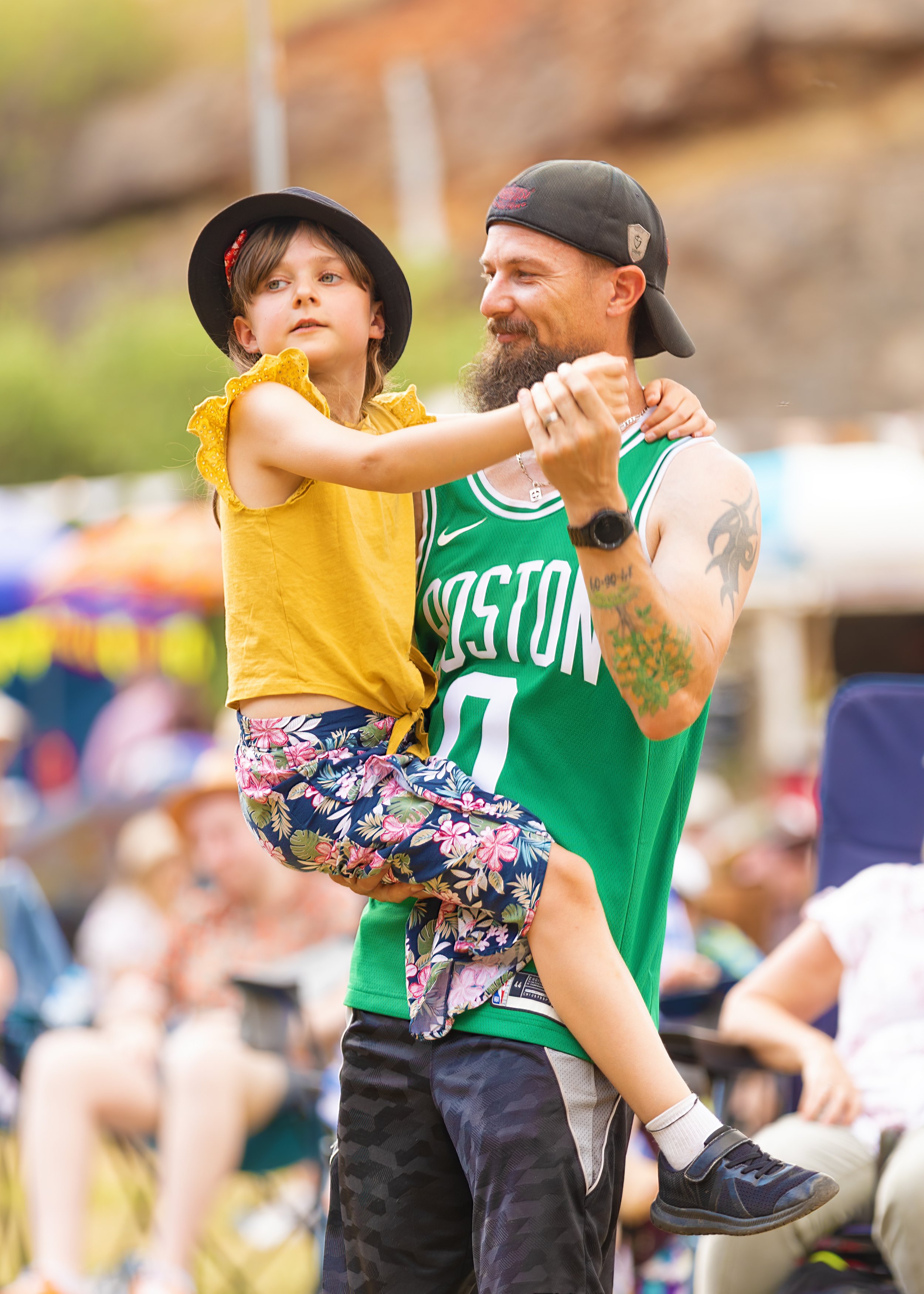 A man dances with a child.