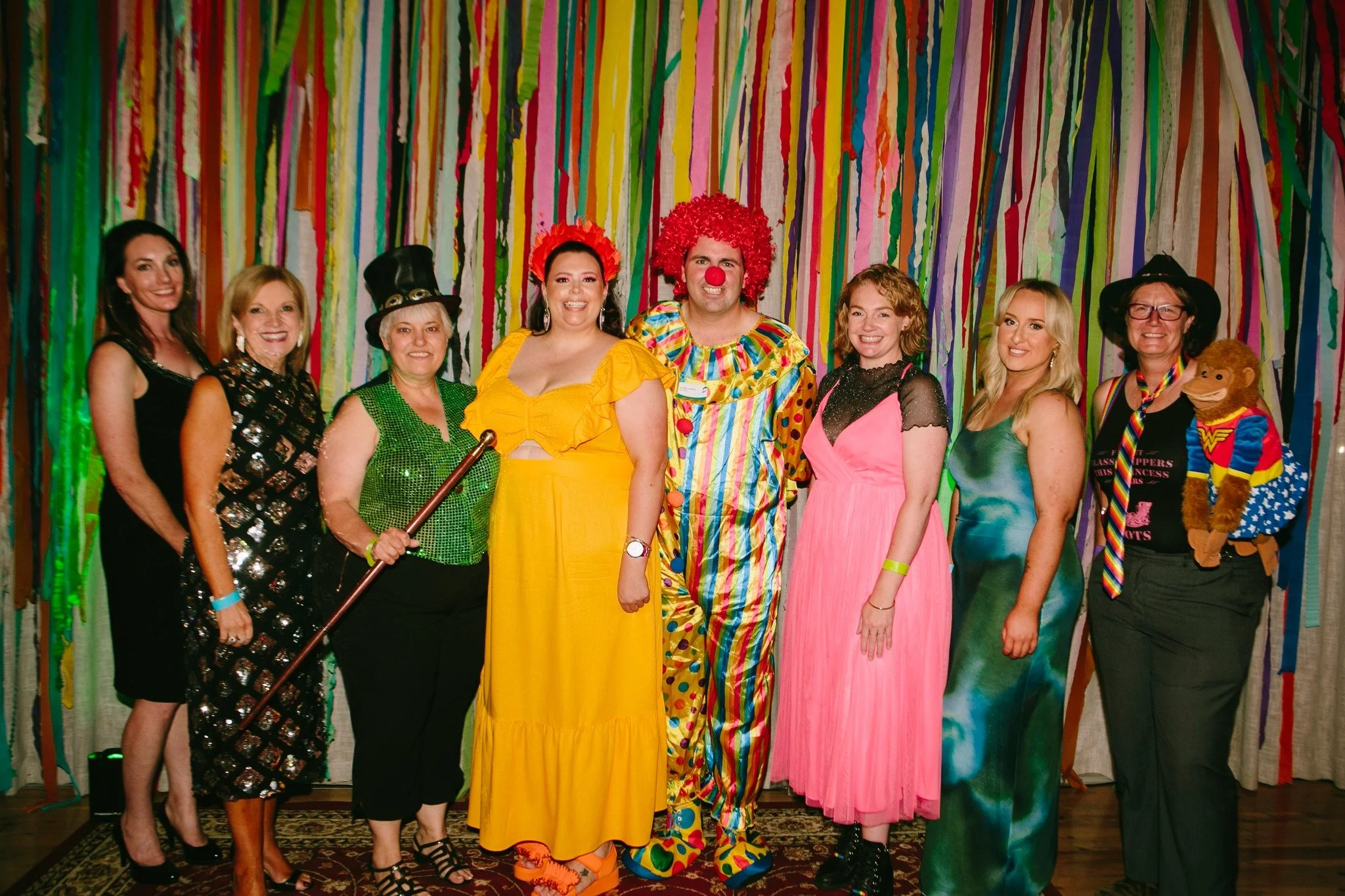 Vibrant Pride Ball event showcasing diverse costumes and joyful dancing.
