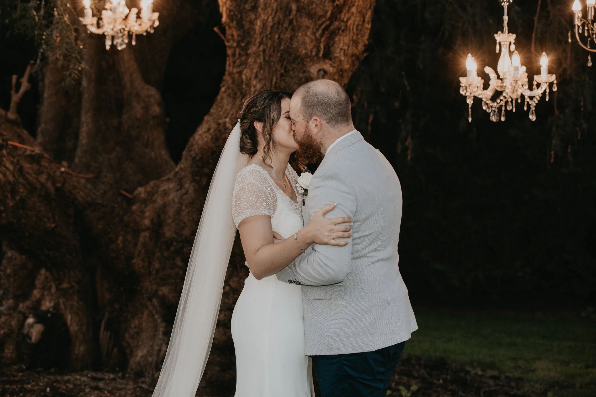 The Bride and Groom share a kiss.