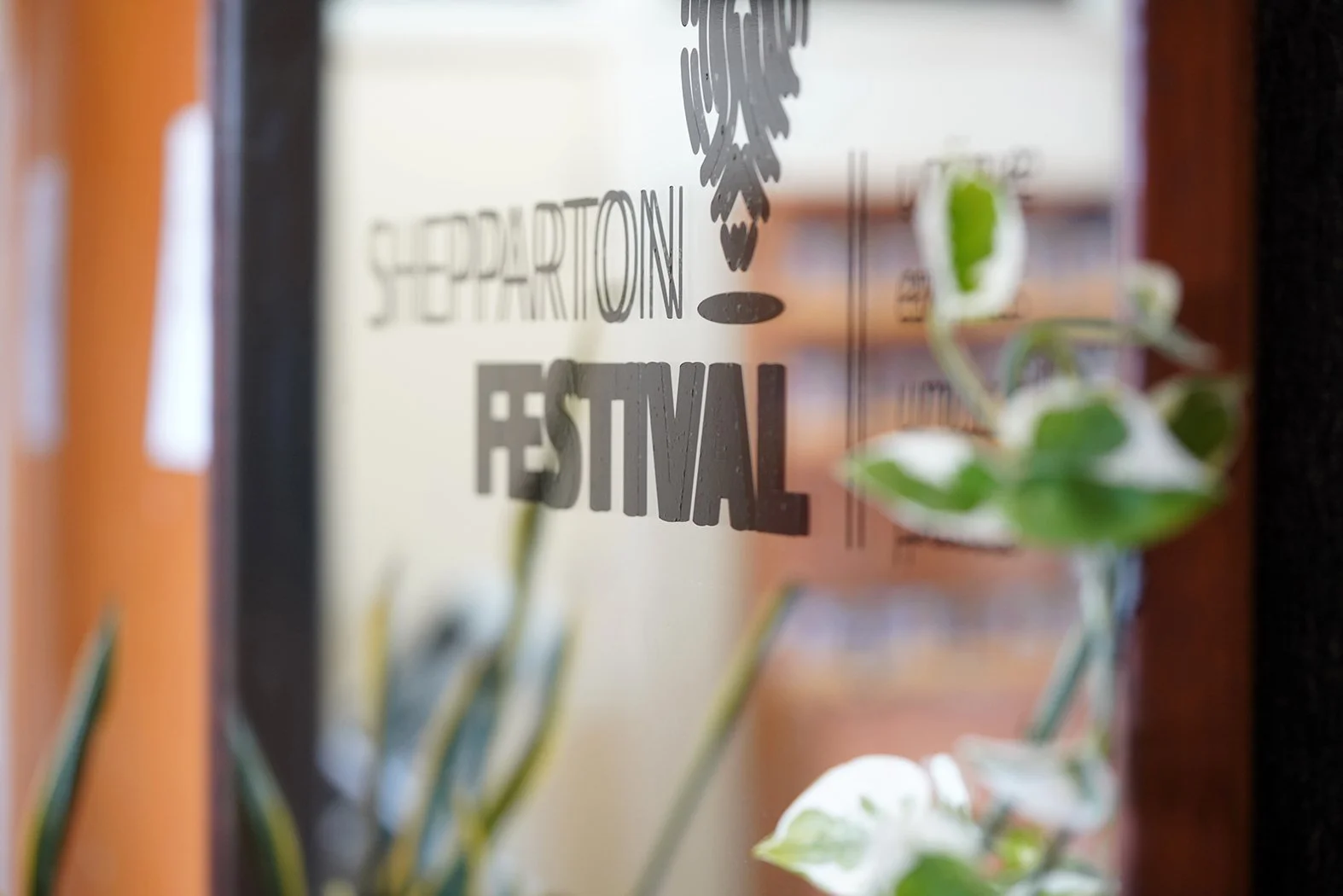 The Shepparton Festival Logo on a mirror.