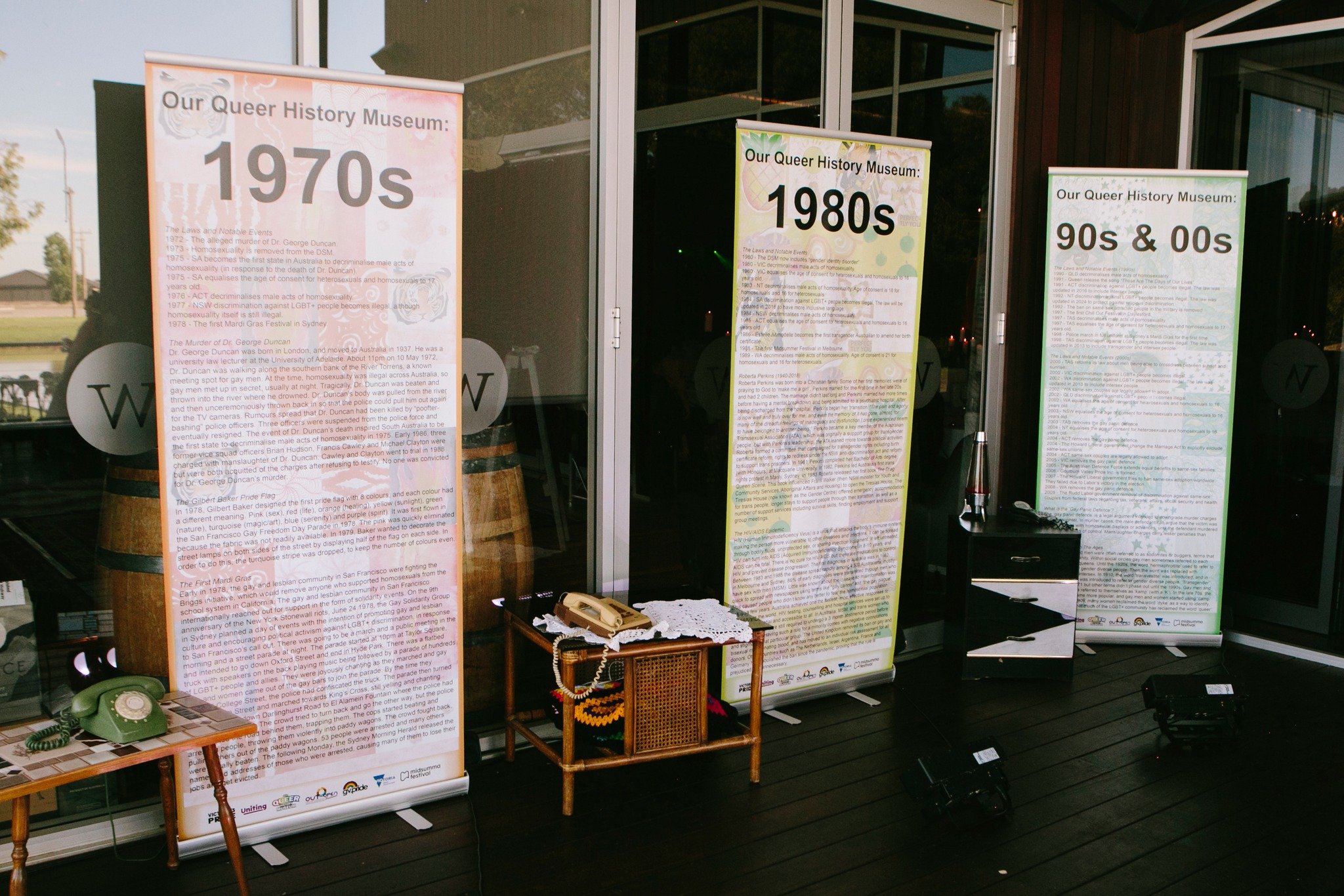 Vibrant Pride Ball setting featuring rainbow-themed decor and sparkling disco lights.