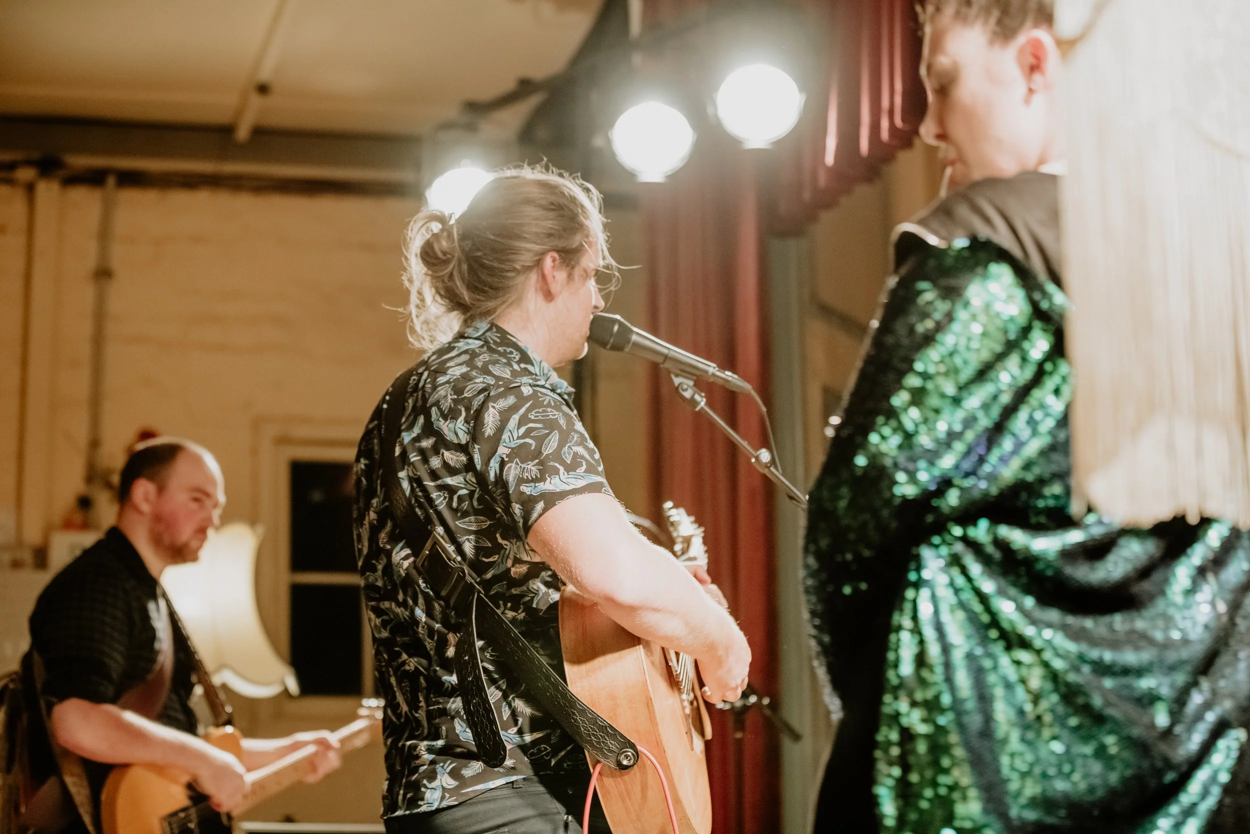 Three people performing together.