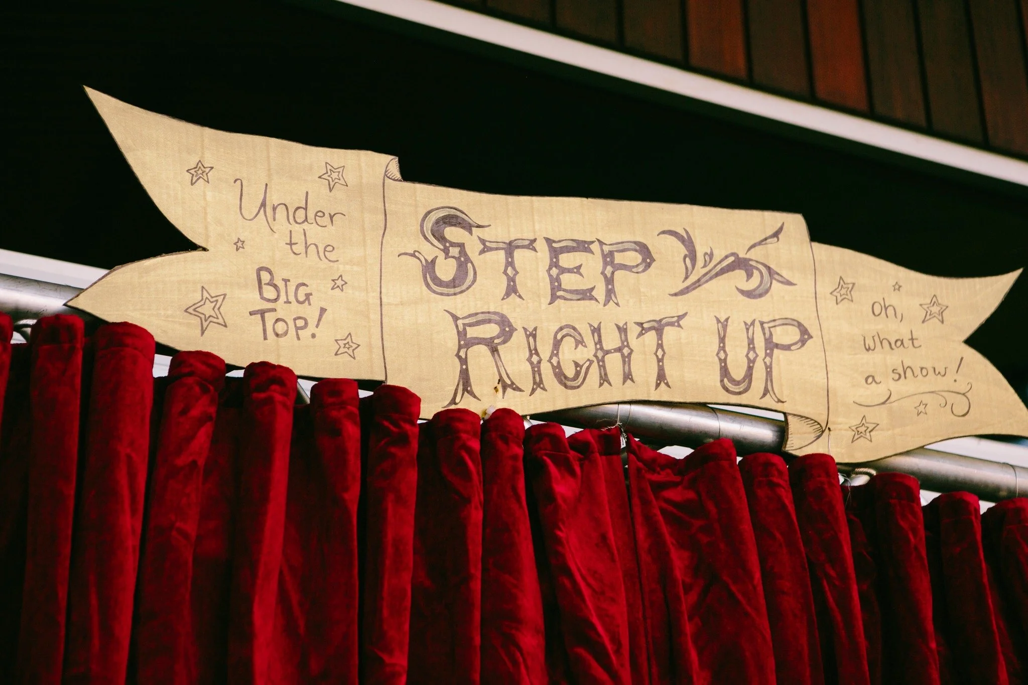 Colorful Pride Ball decorations with rainbow flags, balloons, and glittering disco balls.