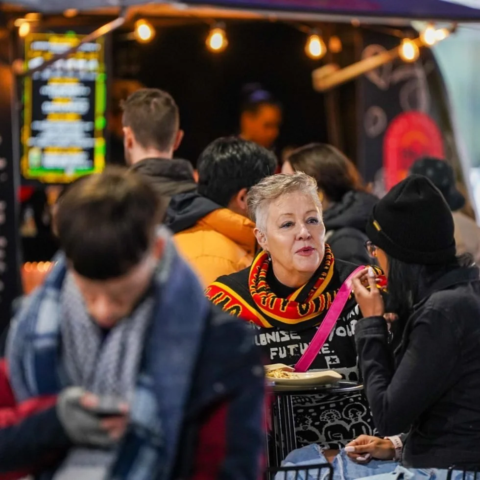 Urban crowd feasting at a food truck during Treaty Day Out.