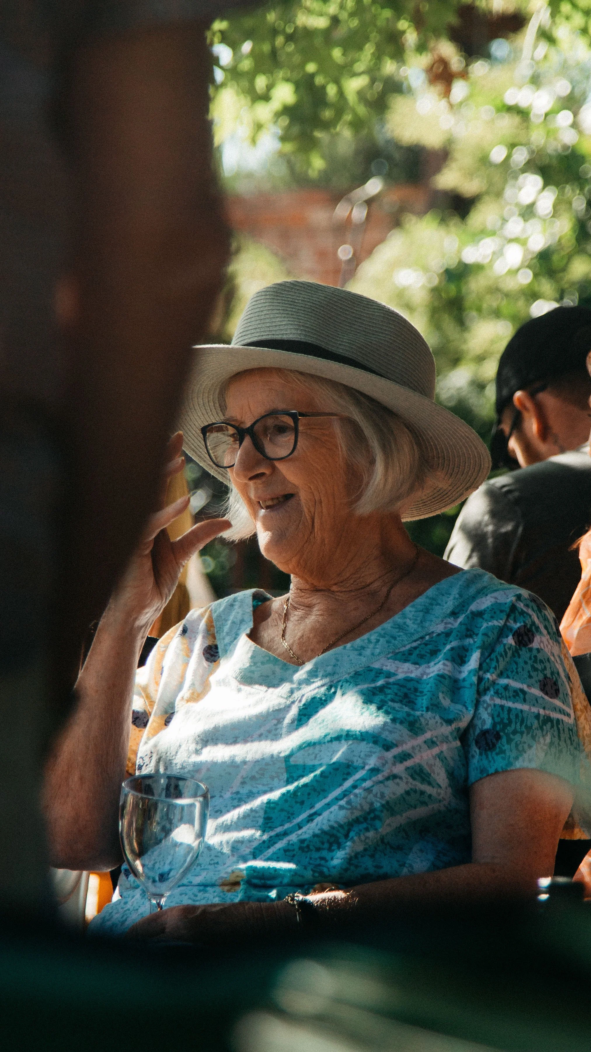 A chic woman donning a stylish hat, radiating confidence and grace.