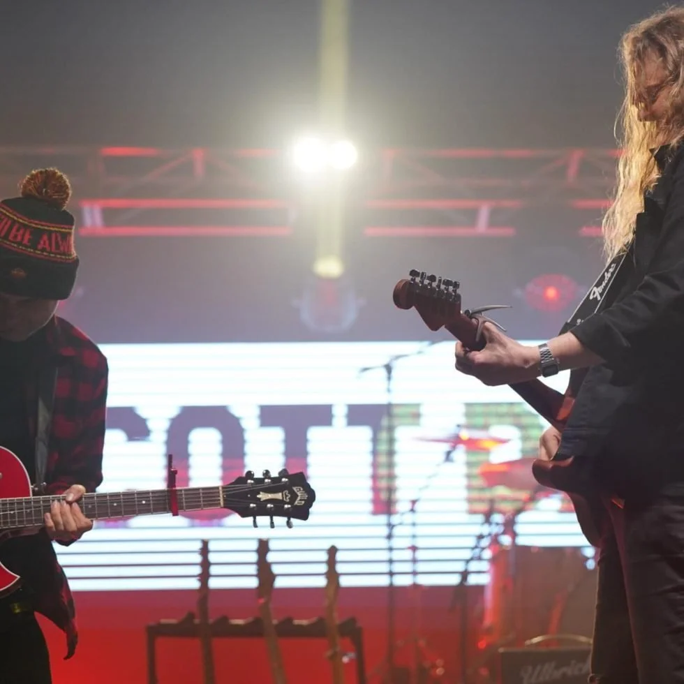 Scott Darlow and guitarist performing on stage at a concert for Treaty Day Out.