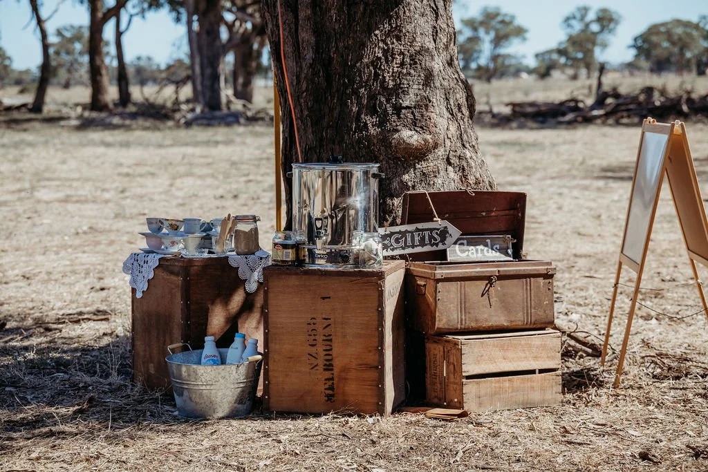 Rustic wedding decor: A charming water station with vintage-inspired details for guests to quench their thirst.