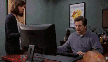 Ron swanson throwing a computer in the trash can with gusto like a true, libertarian.