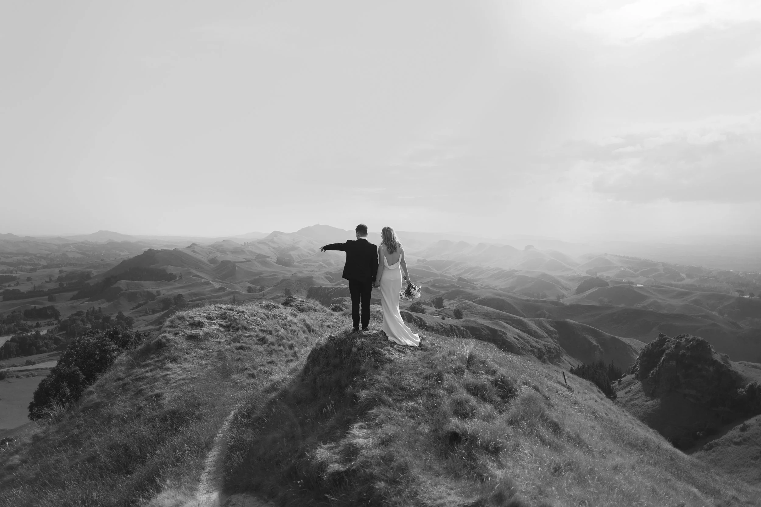 Bride and groom sharing sunset portraits up Te Mata Peak in Hawkes Bay wedding