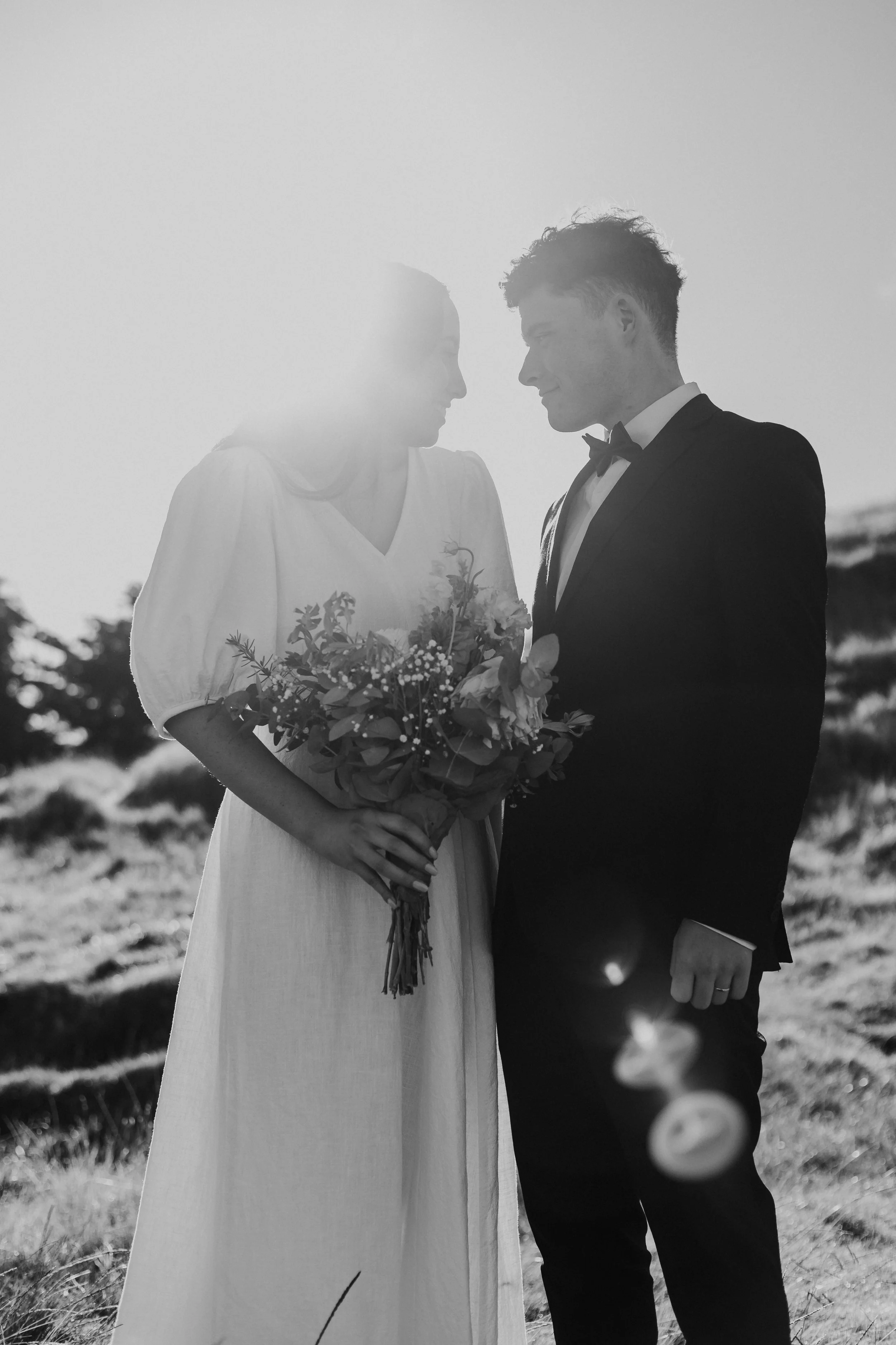 Bride and groom sharing sunset portraits in New Zealand wedding