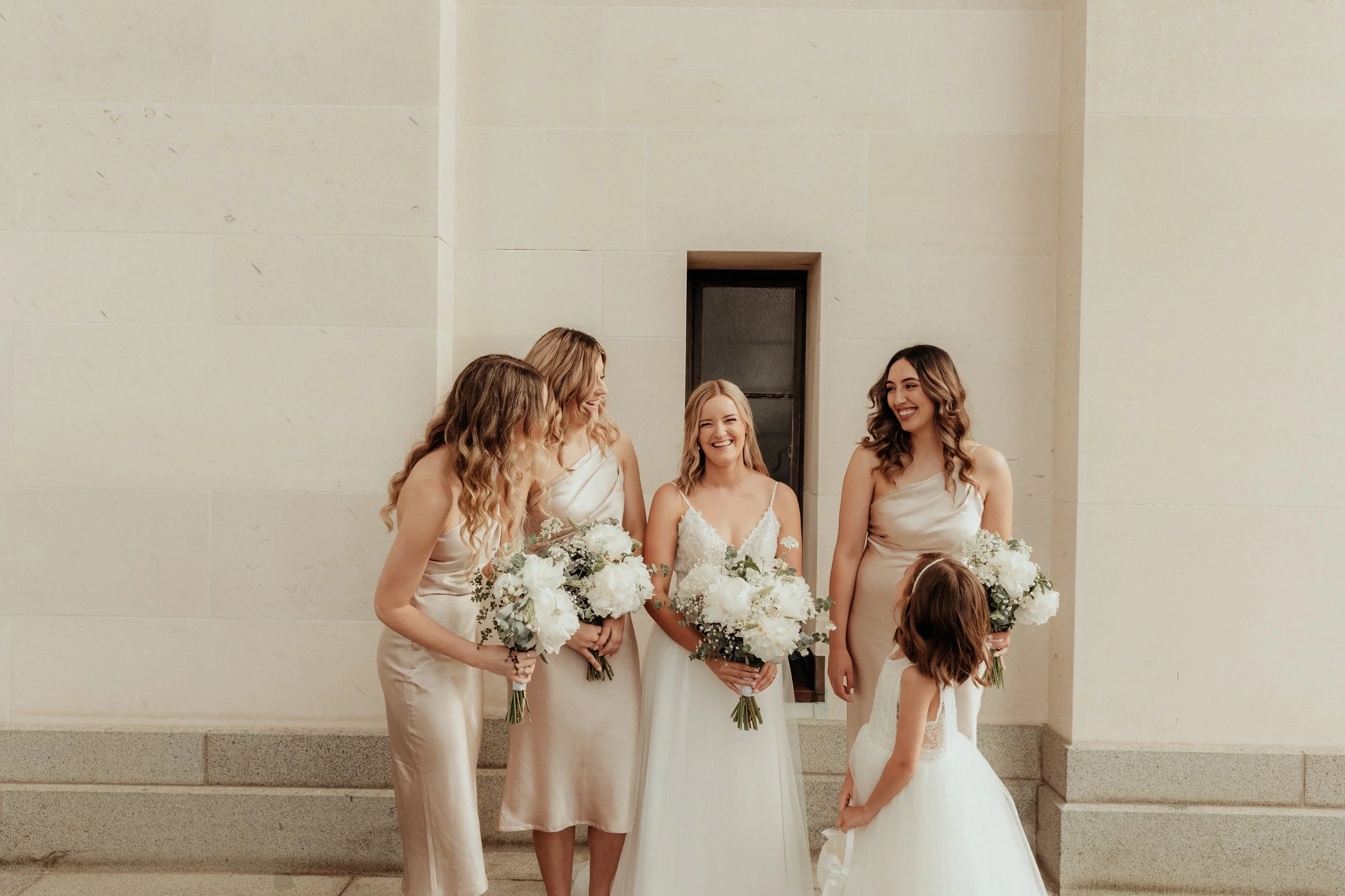 Candid portrait of bride and bridesmaids at elegant Auckland wedding.