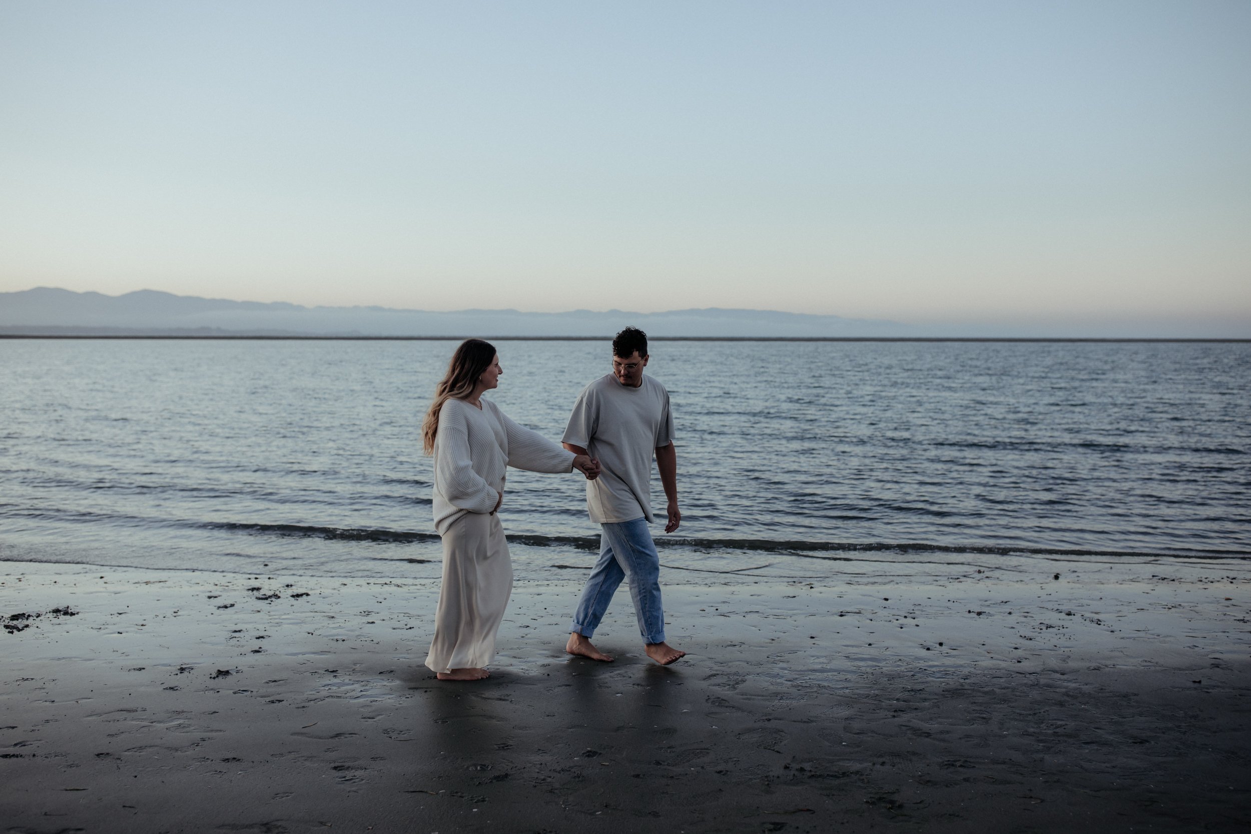 Candid maternity lifestyle photoshoot at a Nelson beach.