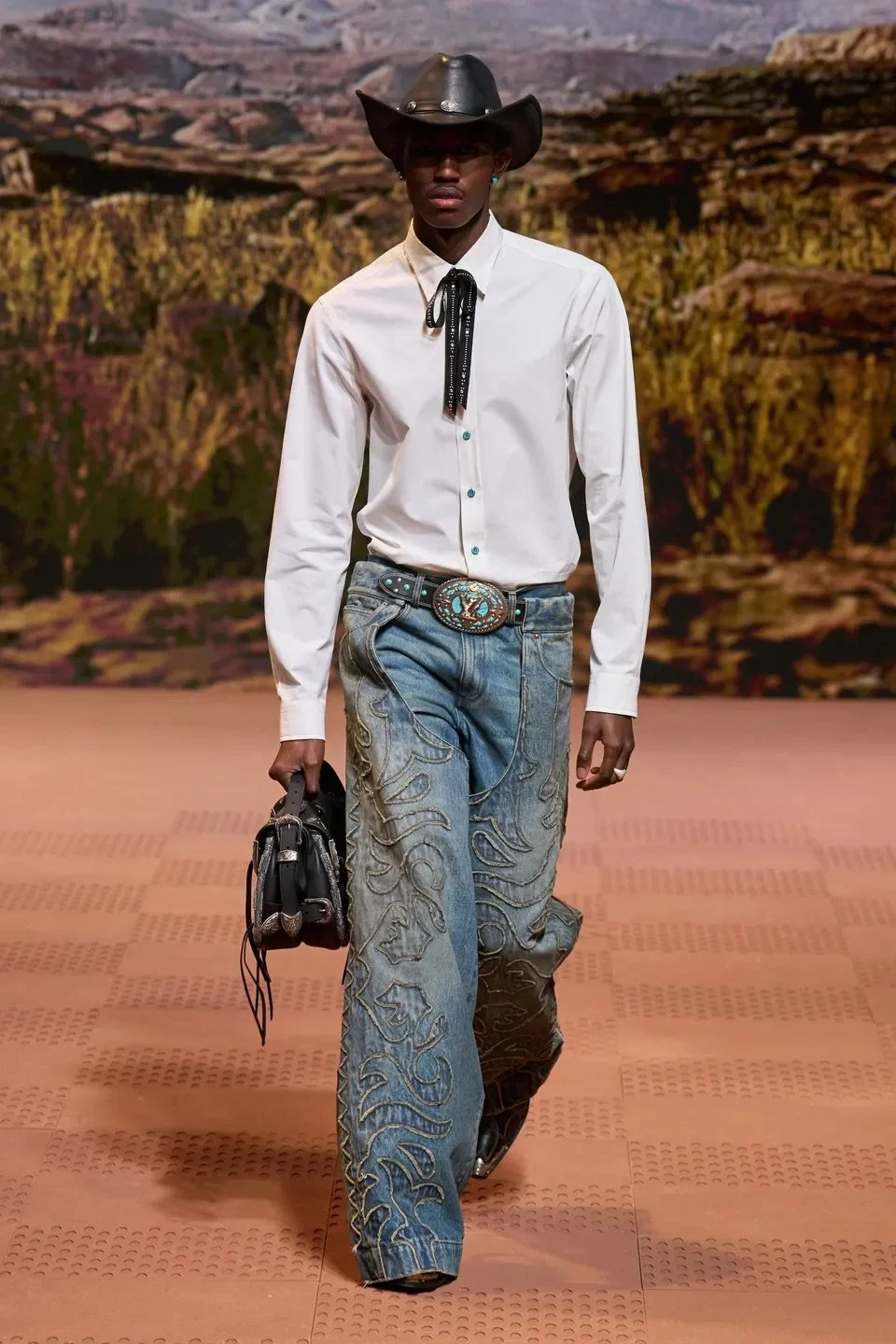 Model Walks in Cowboy Attire For The LV Fall-Winter 2024 Show
