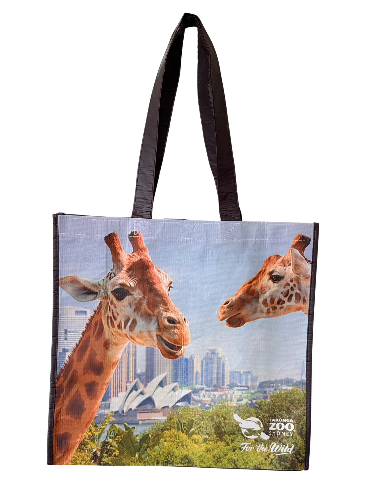Reusable shopping bag with images of two giraffes and Sydney city skyline in background.