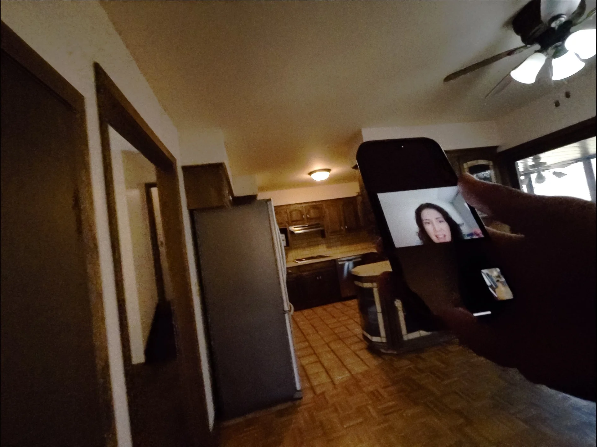 Brandon Archie showing a relocation client a home vis facetime video call