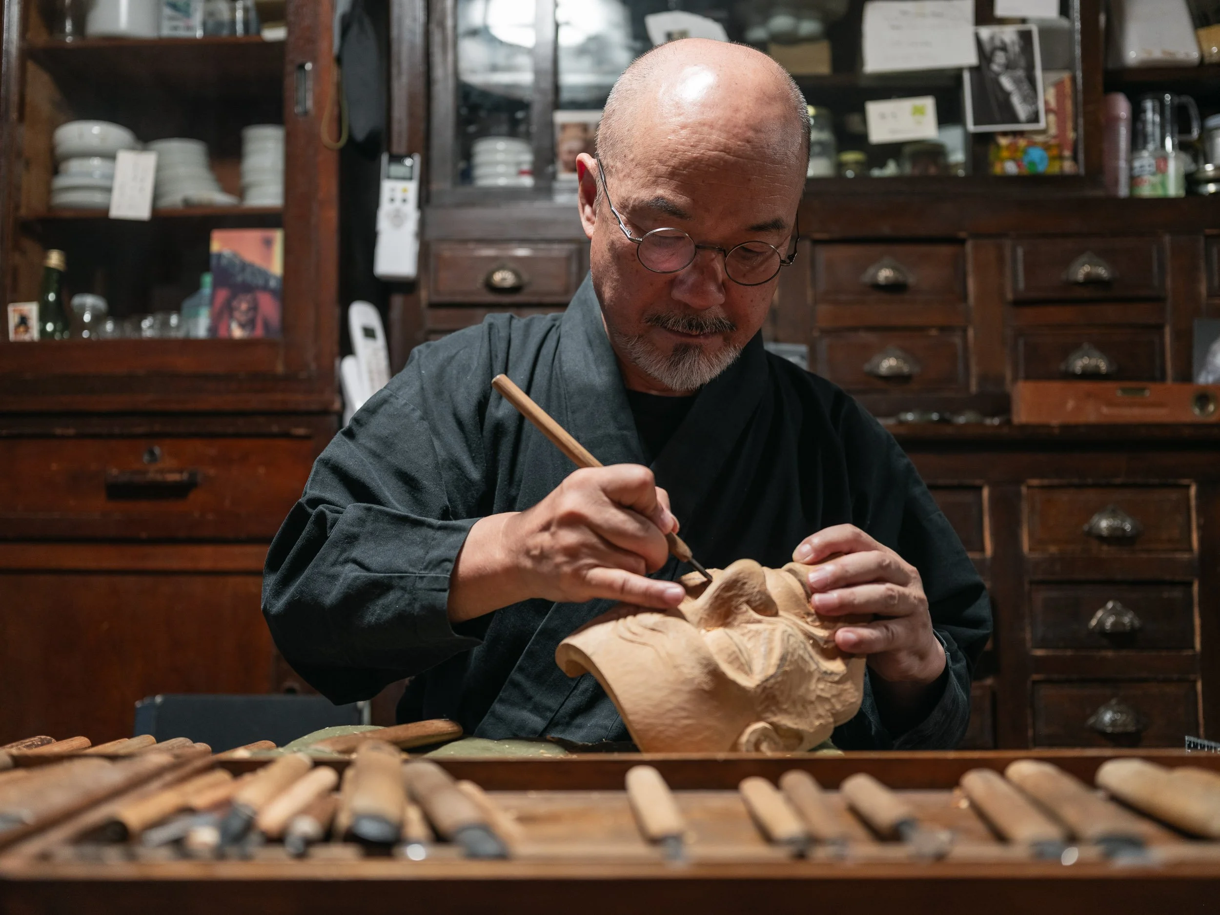 Noh mask master sculptor Ohtsuki Koukun in his workshop in Kyoto.