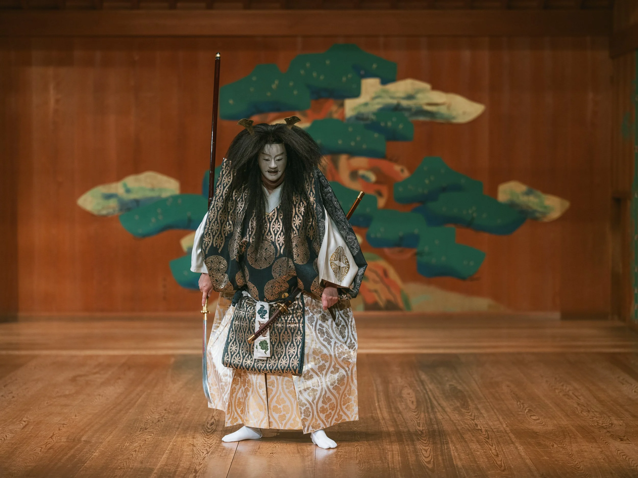 Kuroemon Katayama in the costume and mask of “Funa-Benkei,” on stage in Kyoto, Japan, during the final rehearsal.