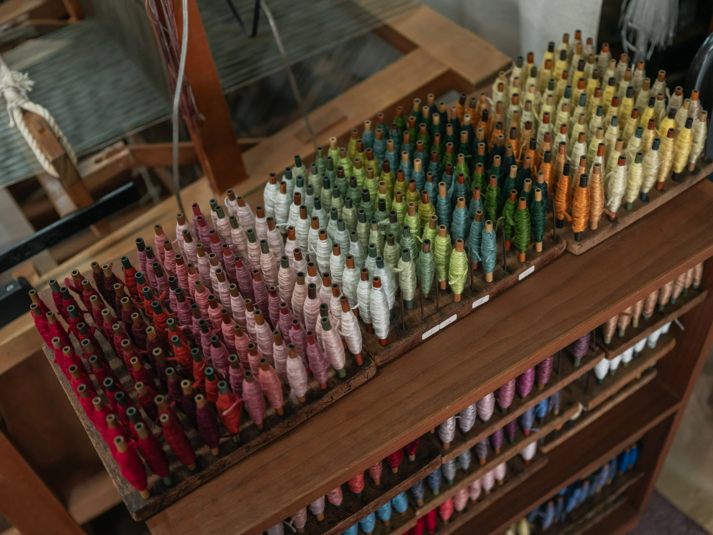 Spools of weaving thread in a workshop producing costumes for Noh theatre.
