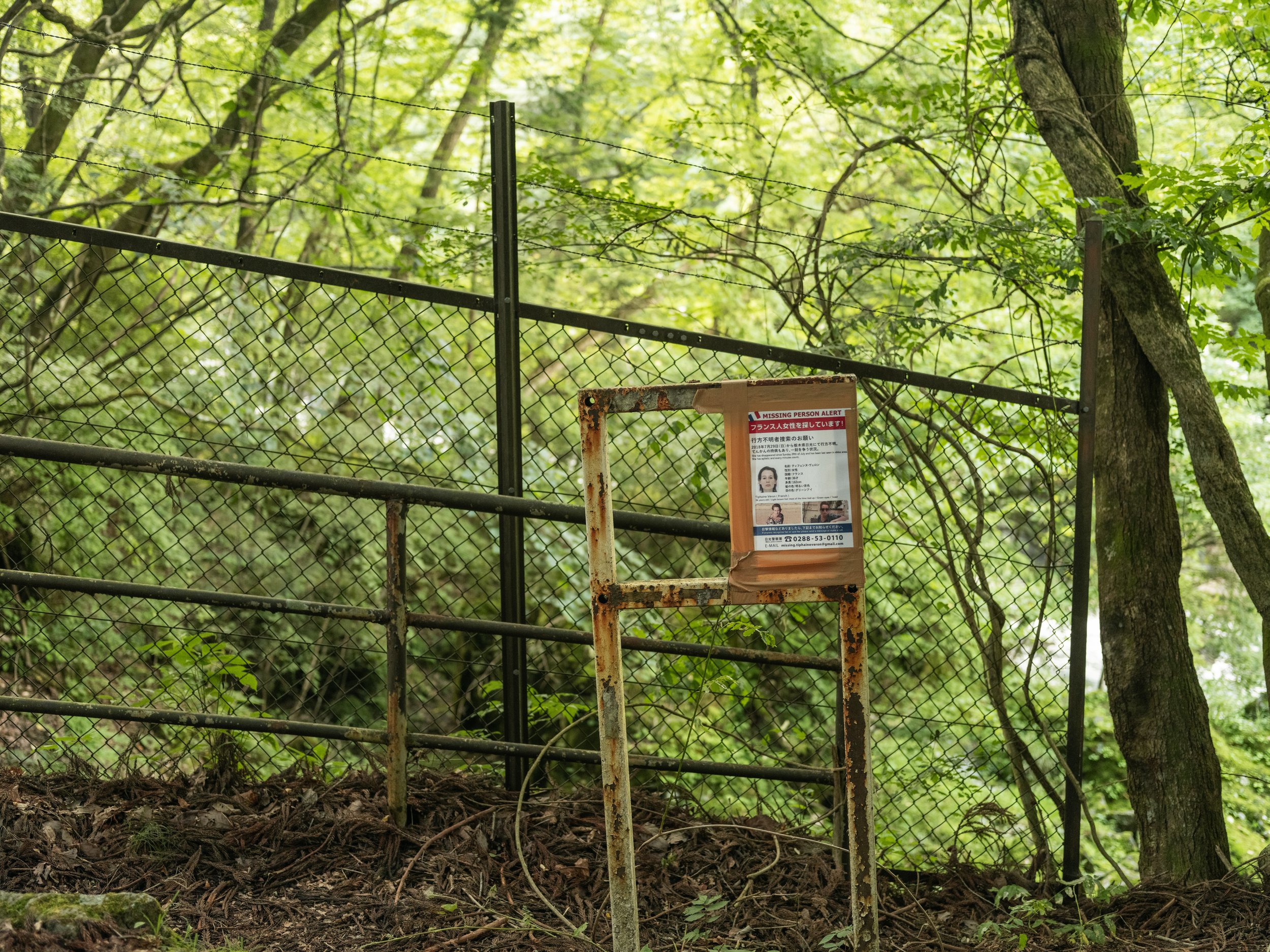 A “missing person” paper for Tiphaine is tape close to Kanmangafuchi Abyss on July 18, 2023 in Nikko, Japan.