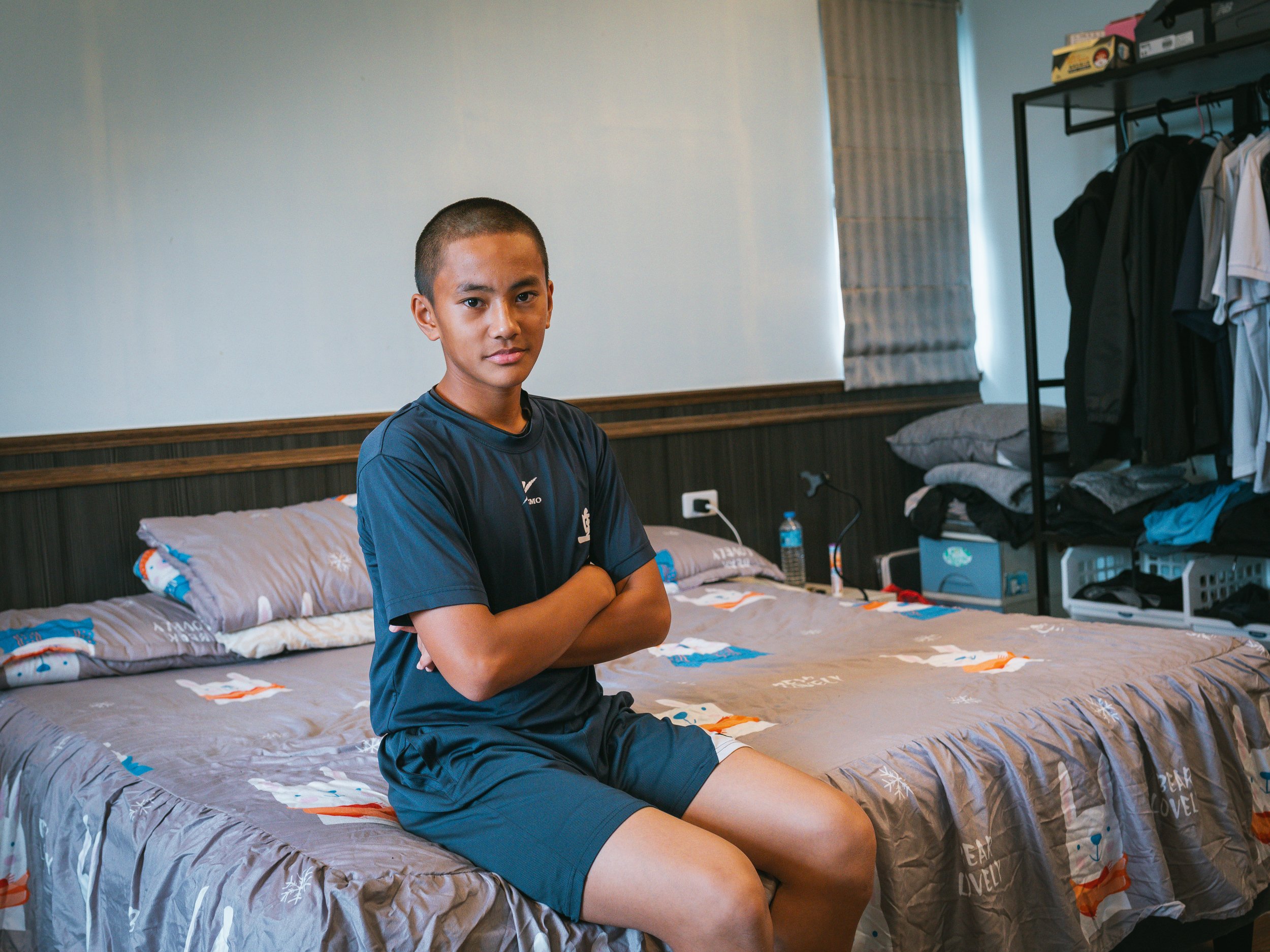 Yeh Hao-yu, the captain of the baseball Team A of Bei-Nan Elementary School, in his room for a photo.