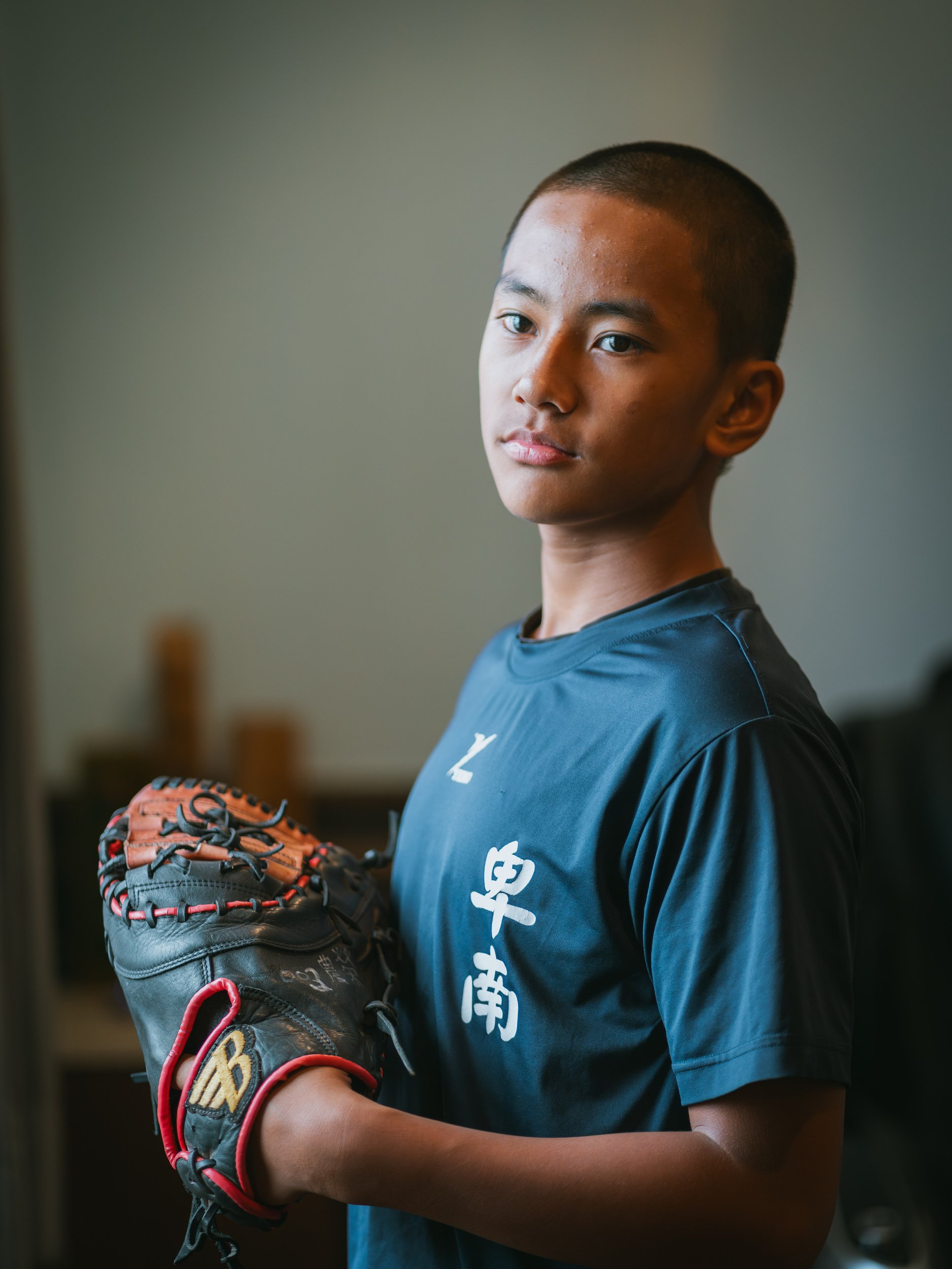 Yeh Hao-yu, the captain of the baseball Team A of Bei-Nan Elementary School, in his room for a photo.