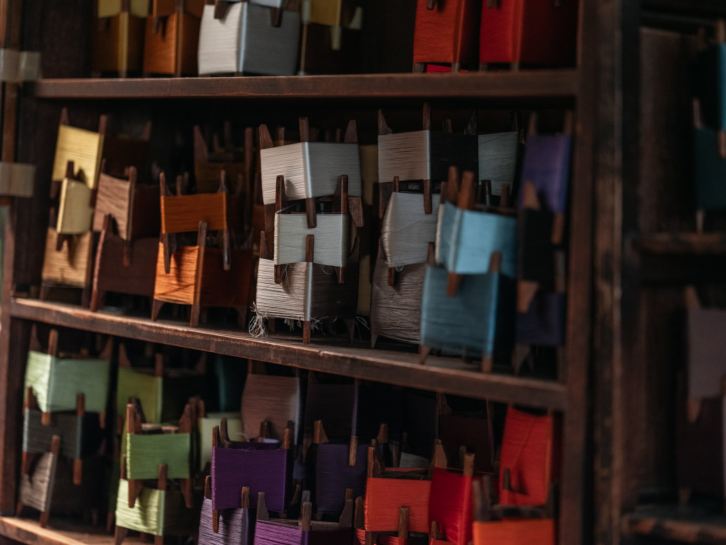 Spools of weaving thread in a workshop producing costumes for Noh theatre.