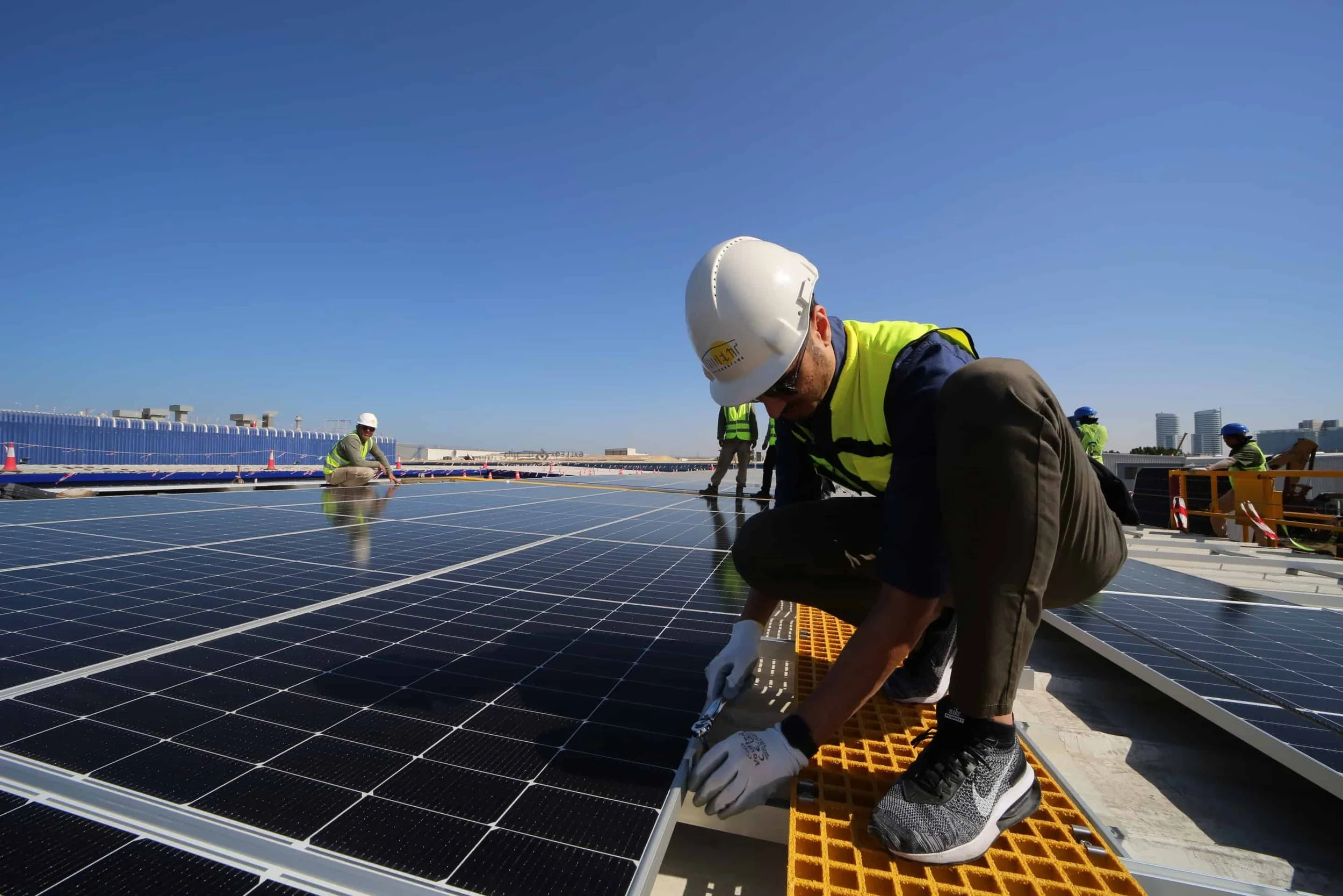 Engineer Fixing Solar Panels.jpg