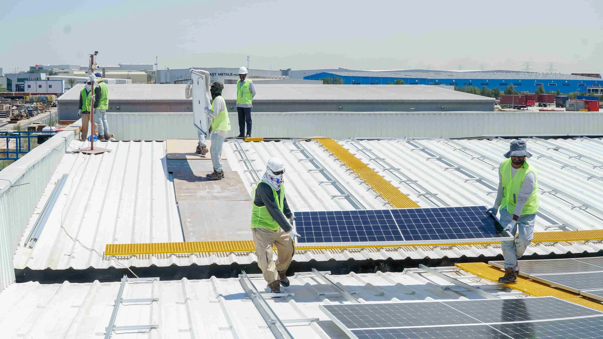Lifting Solar Panels on Roof.jpg