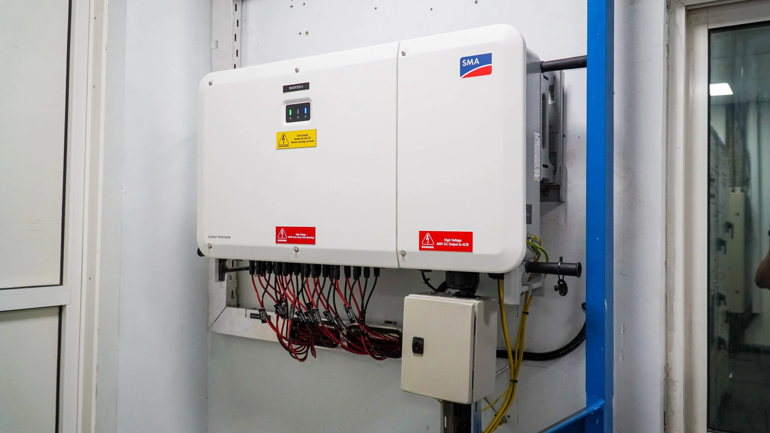 Solar panel array on a large warehouse roof in Dubai.jpg