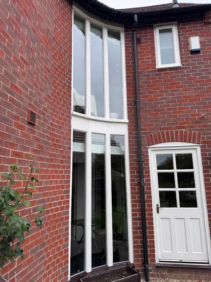 Tall full height fixed hall feature window with three upper and three lower panes 
