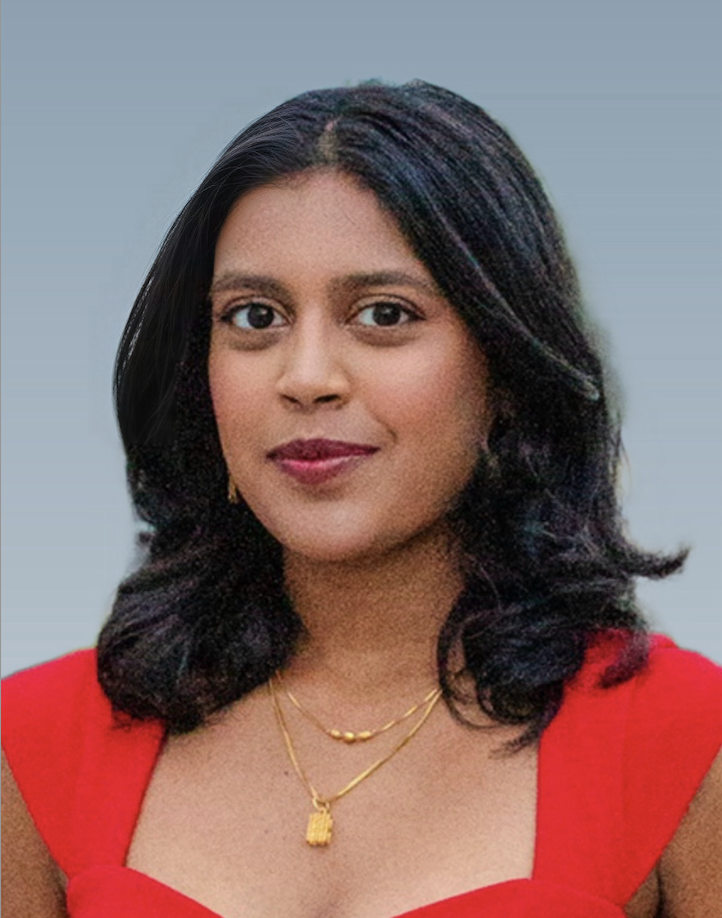 A woman with dark hair smiling in a red blouse