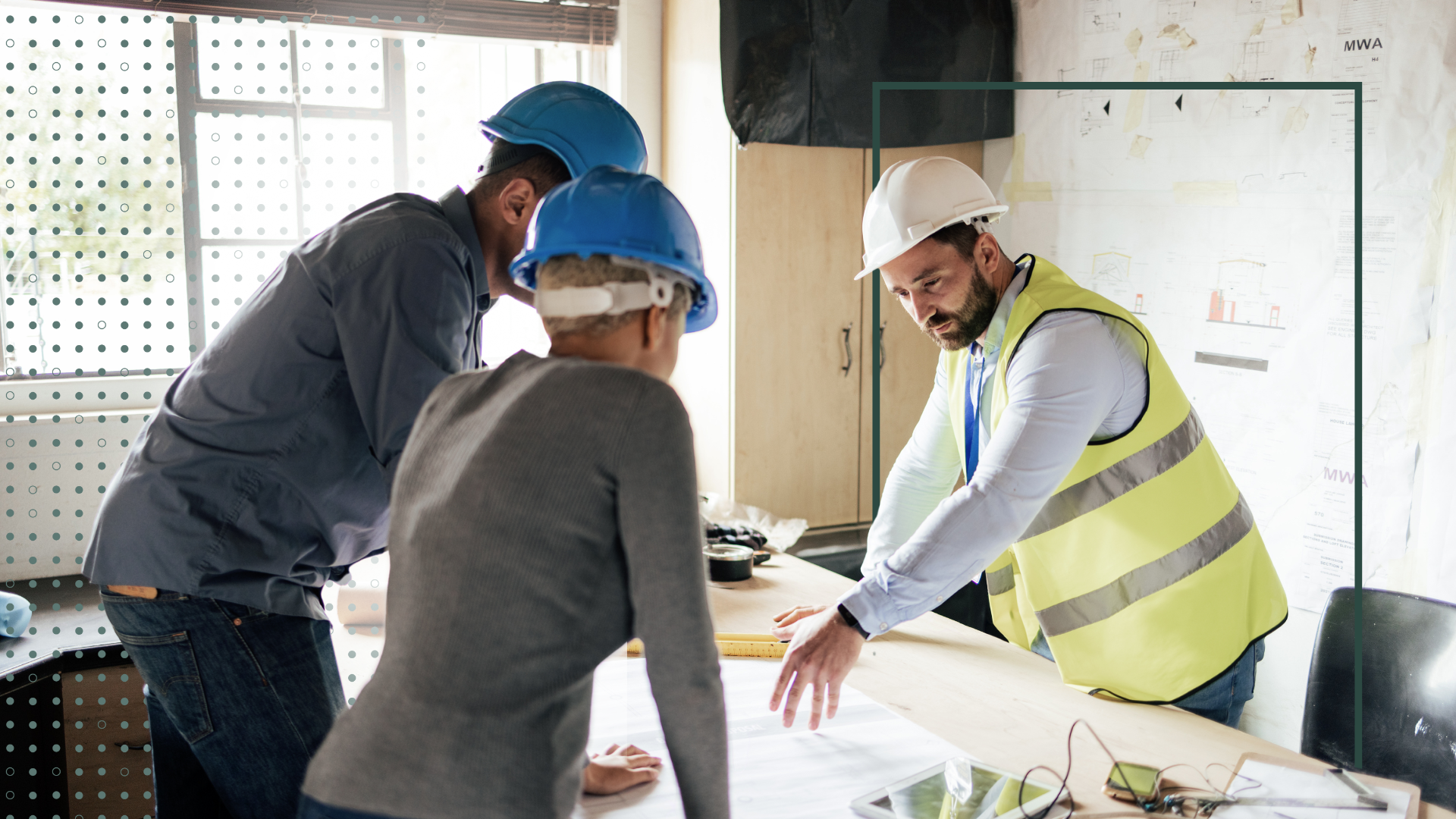Construction workers looking at plans