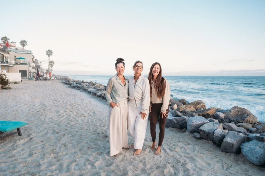 three women at bizz bitch retreat on the beach